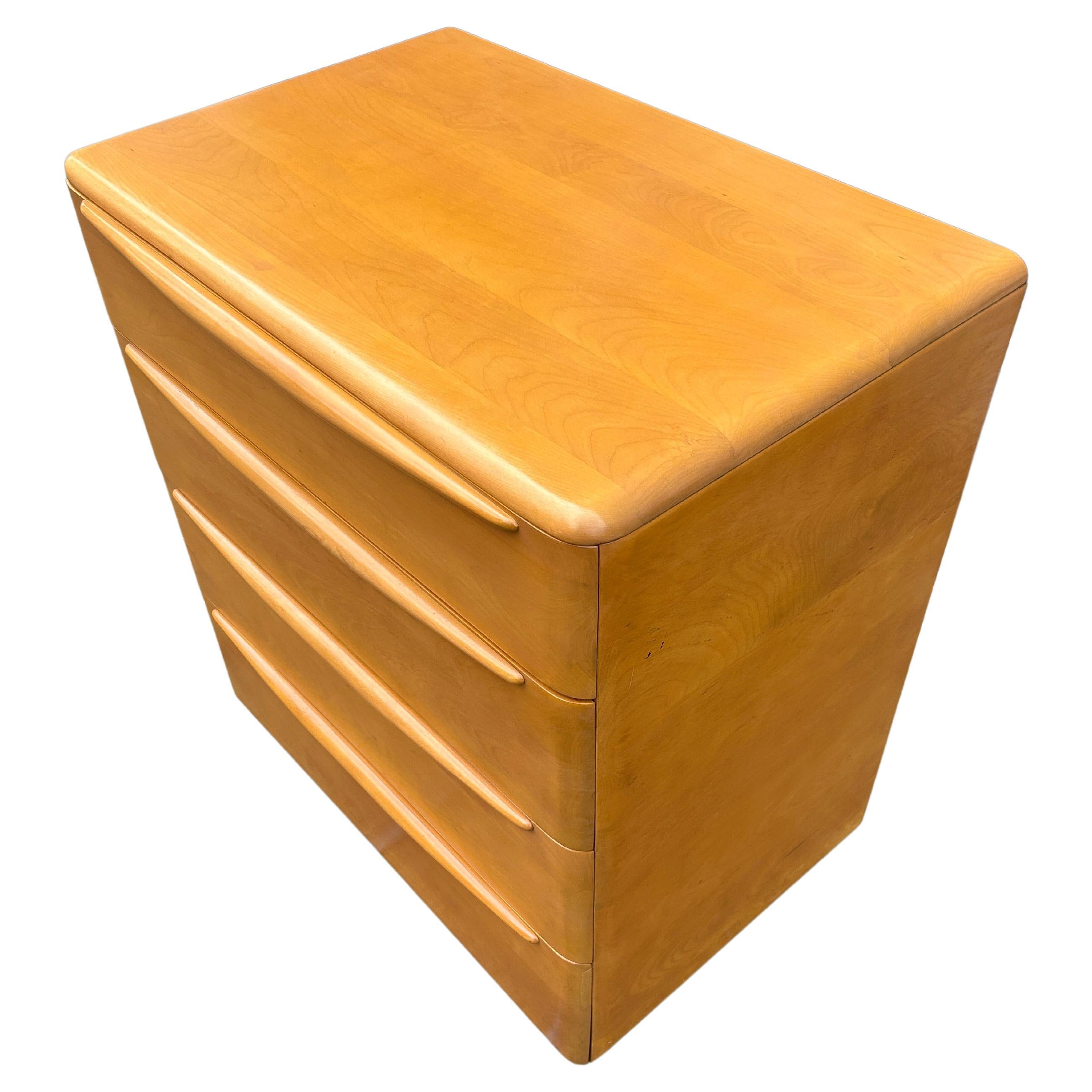 Timeless Heywood Wakefield Mid-Century Modern 4 drawer tall dresser. All solid maple construction with sculpted legs and drawer handles. Good vintage condition original blonde finish clean inside and out. Circa 1950 - Located in Brooklyn