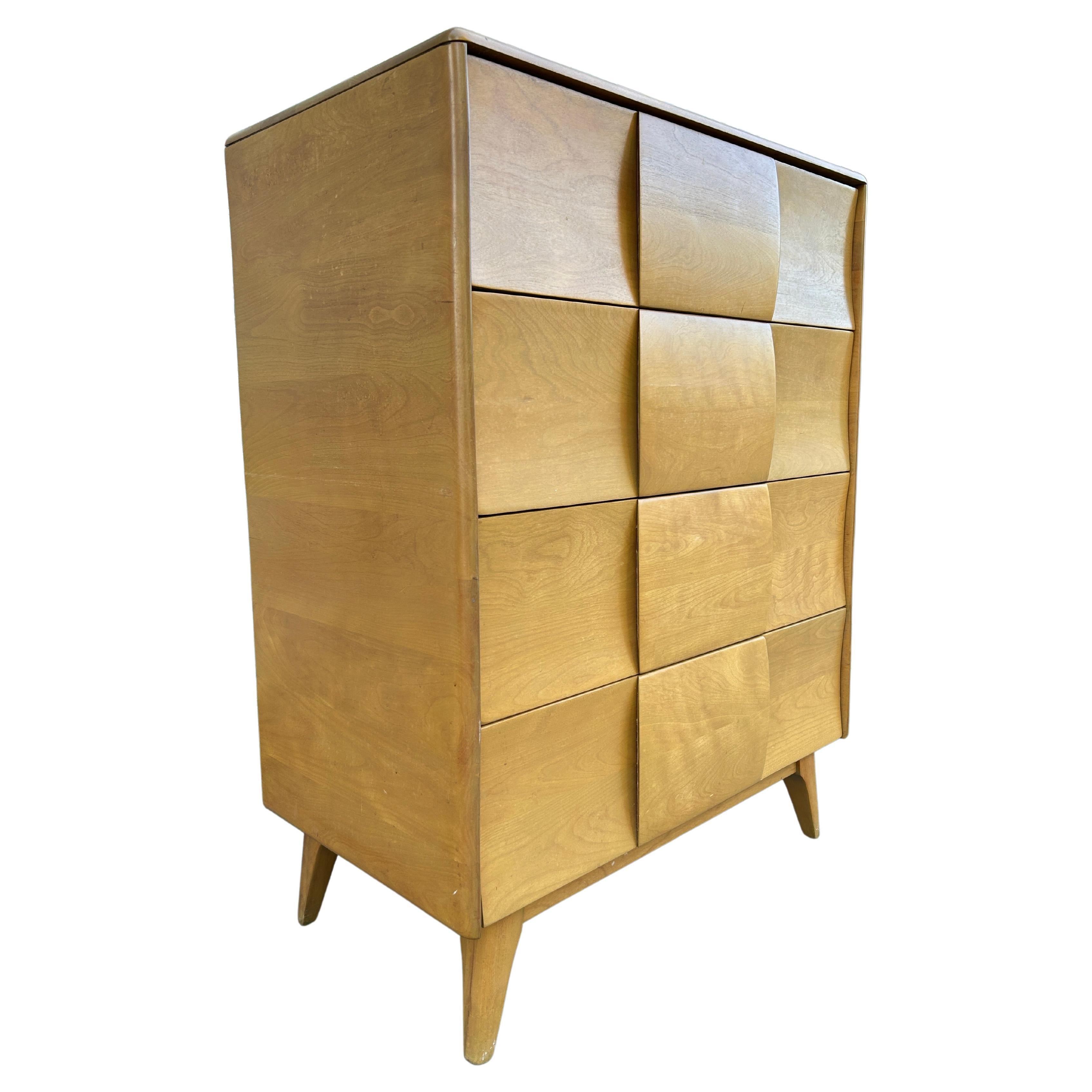 Timeless Heywood Wakefield Mid-Century Modern 4 drawer tall dresser. All solid maple construction with sculpted legs and drawer handles. Good vintage condition original blonde finish. Circa 1950 - Located in Brooklyn NYC.

Measures 45 inches high