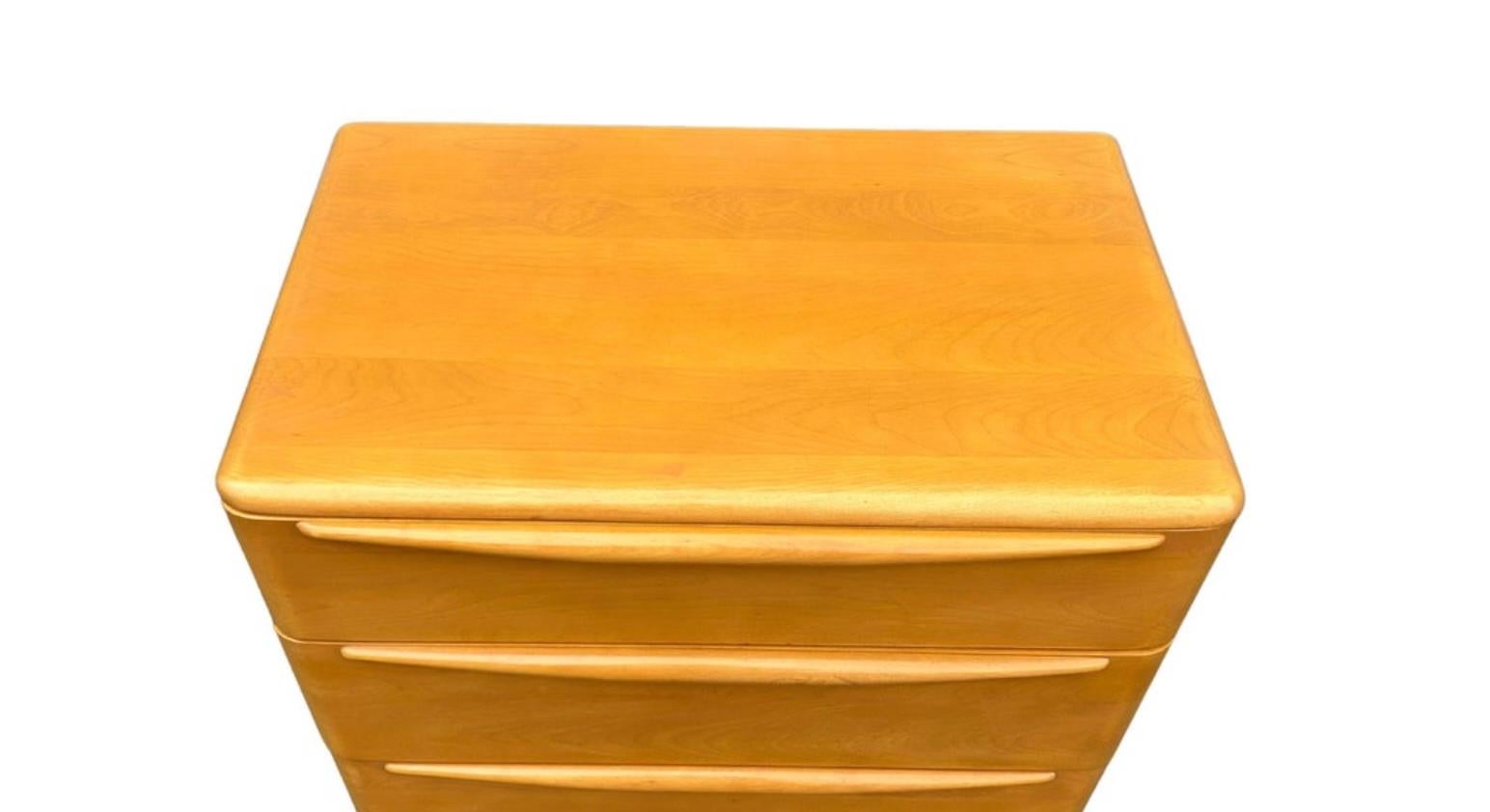 Timeless Heywood Wakefield Mid-Century Modern 5 drawer tall dresser. All solid maple construction with sculpted legs and drawer handles. Good vintage condition original blonde finish clean inside and out. Circa 1950 - Located in Brooklyn
