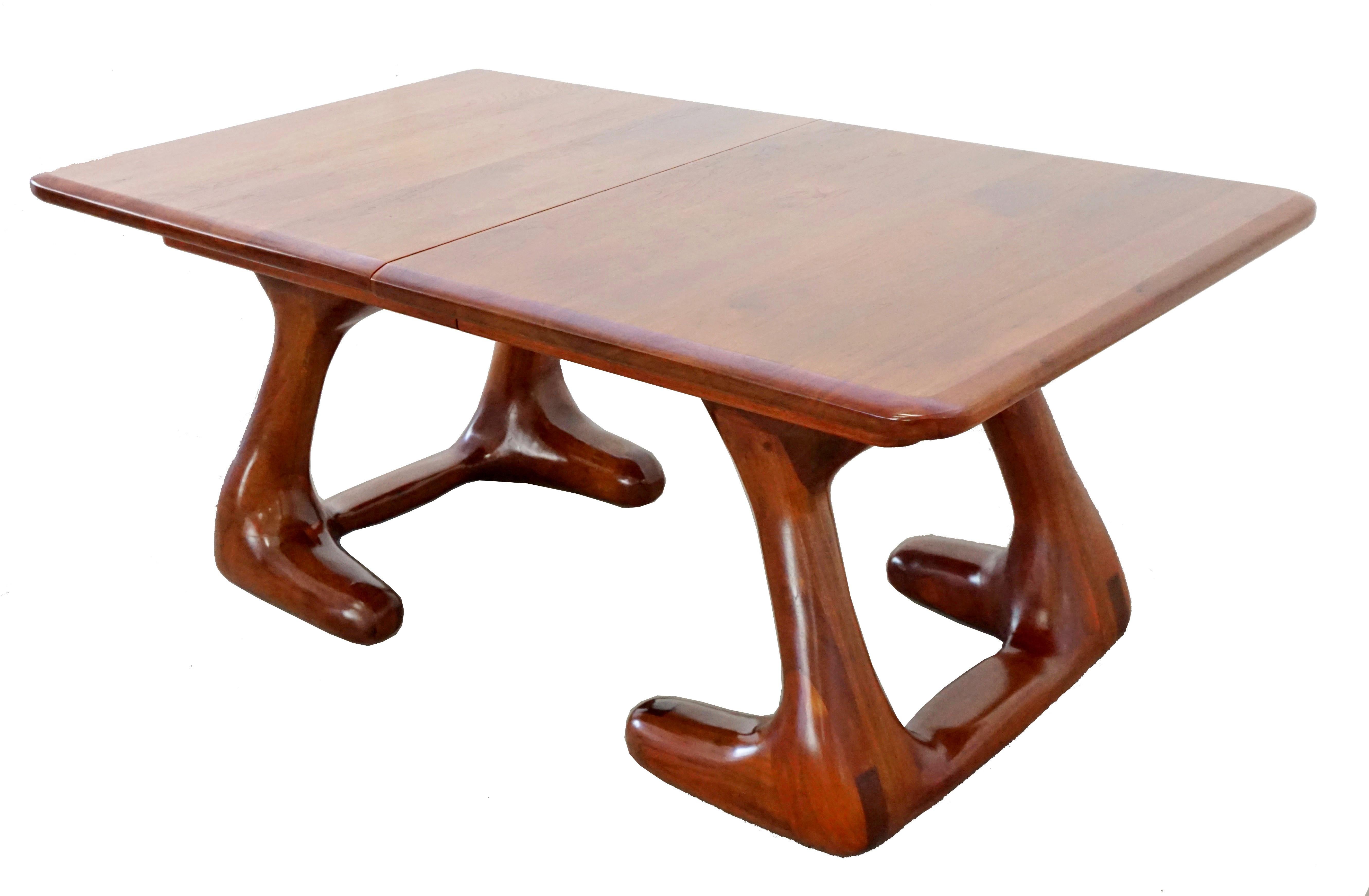 For your consideration is a magnificent American Studio craft carved expandable wooden dining table, with two leaves, in the style of Wendell Castle, circa 1970s. No signature found. In excellent condition. The dimensions are 71