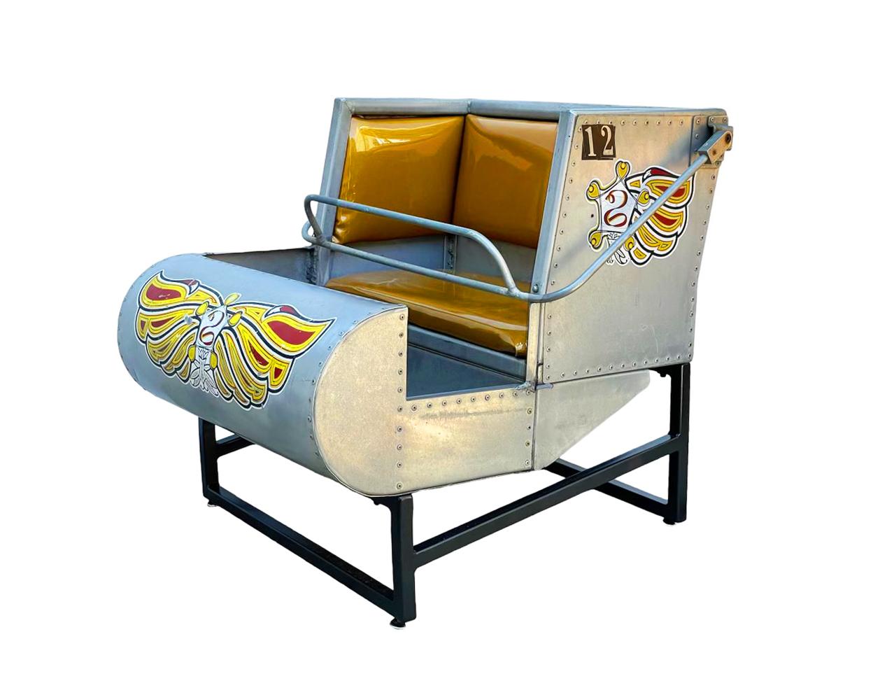 An upcycled work of art. This retired amusement park ride seat has been converted into a usable chair. This is from a kids size ride so it's smaller scale. It will definitely be the conversation in any room. One of a kind, so don't miss out. 