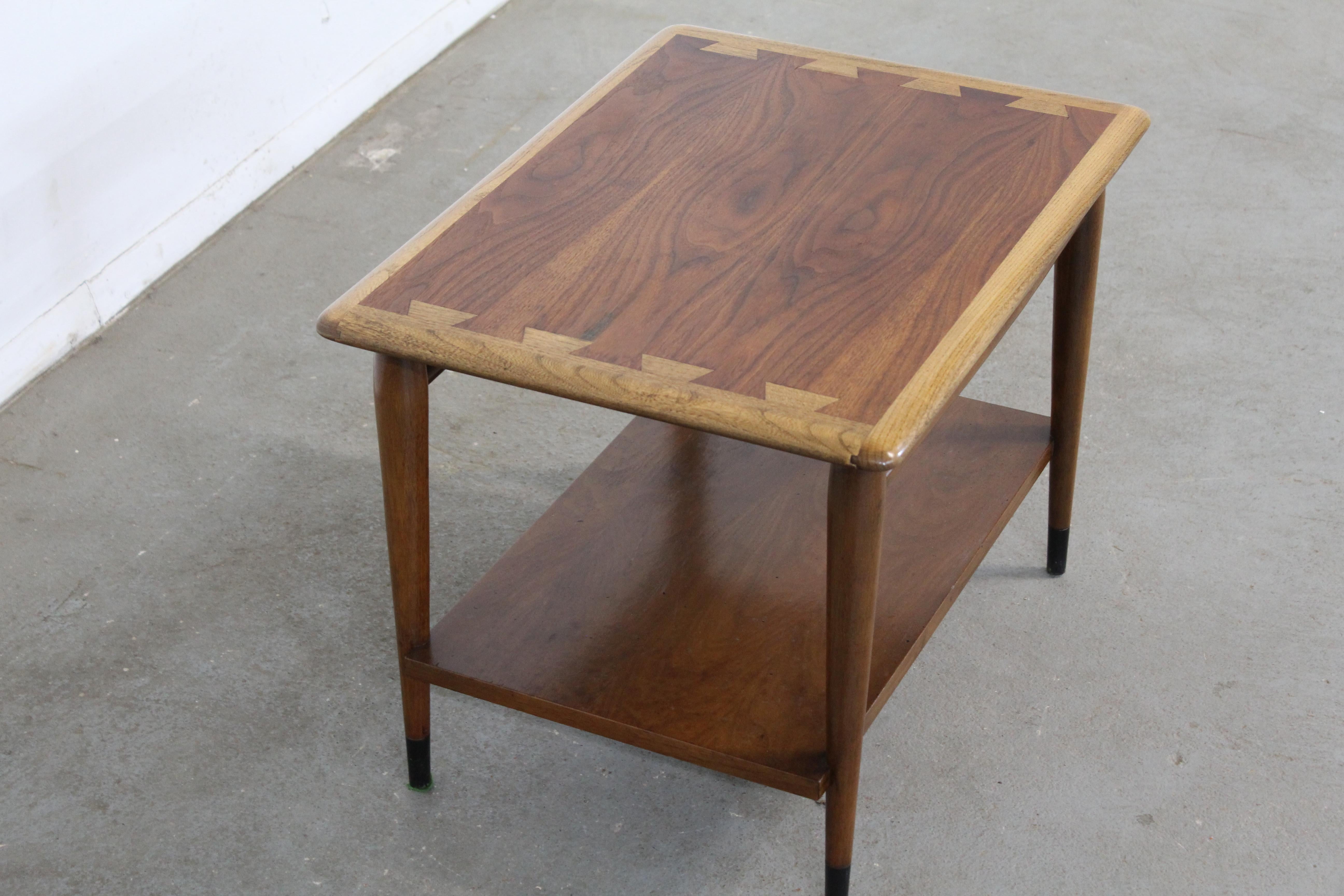 Mid century end table Danish modern by Andre Bus Lane Acclaim 900-05

Offered is a Mid-Century Modern end table from the Lane 'Acclaim' collection, designed by Andre Bus. They have the signature dovetailed design and tapered legs and bottom