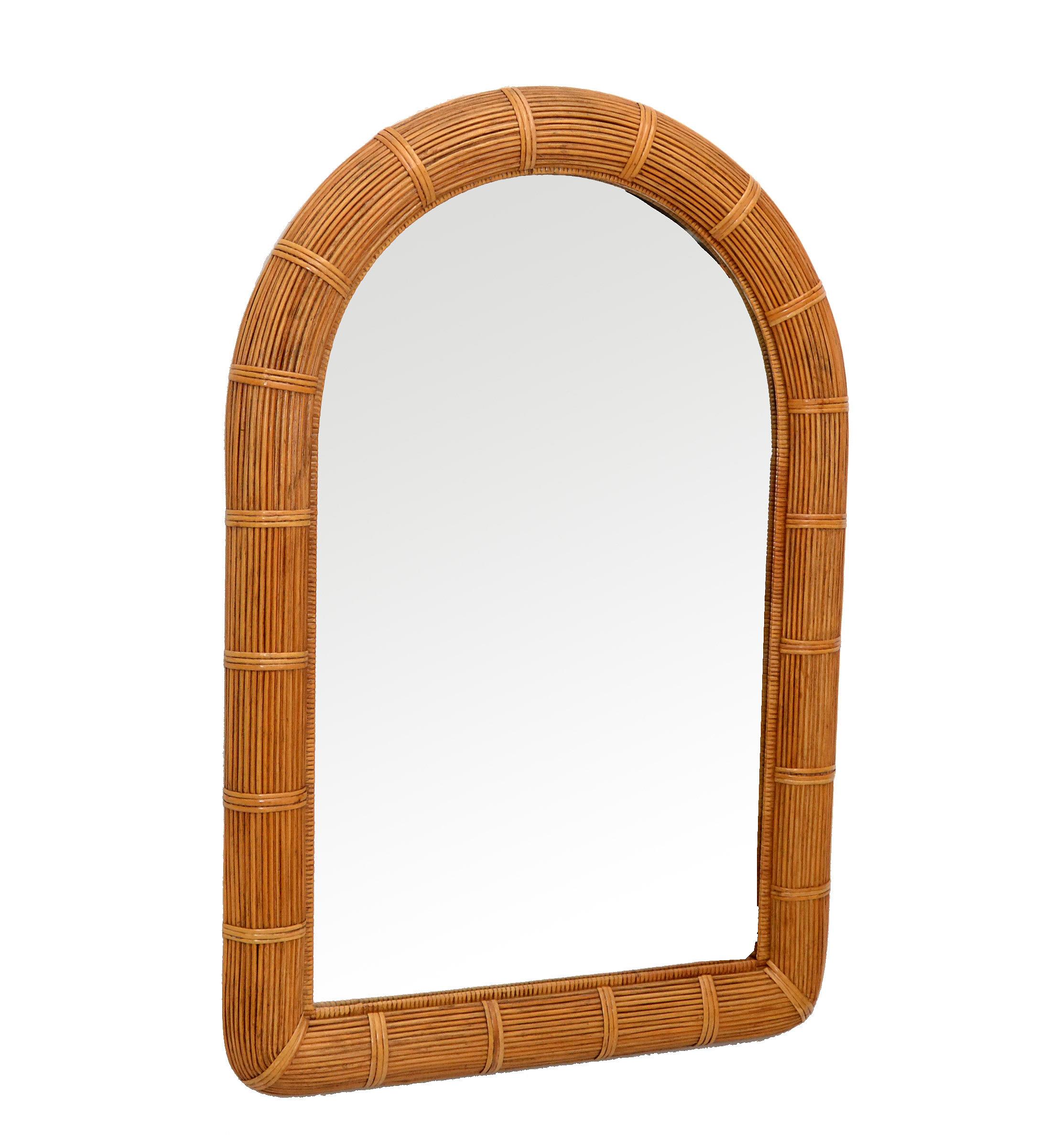 Mid-Century Modern Coastal Bohemian chic arch shaped handwoven pencil reed and wicker wall mirror.
Exemplary construction bent pencil reed are firmly lined on a sturdy wooden backing.
Florida Design for Your Sunroom.
Mirror size: 21 x 35 inches