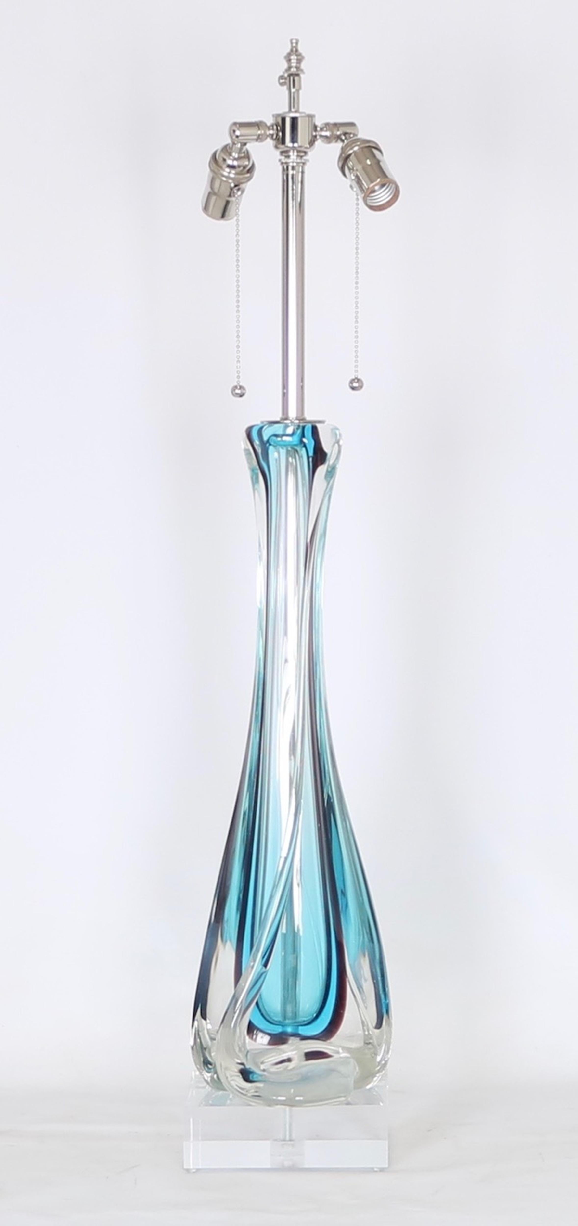 Archimide Seguso Murano Glass lamp from the 1950s. Features include a blue and clear sommerso glass body on a thick Lucite base. The lamp has been fully restored with all new wiring and hardware, including a double socket cluster. Wear appropriate