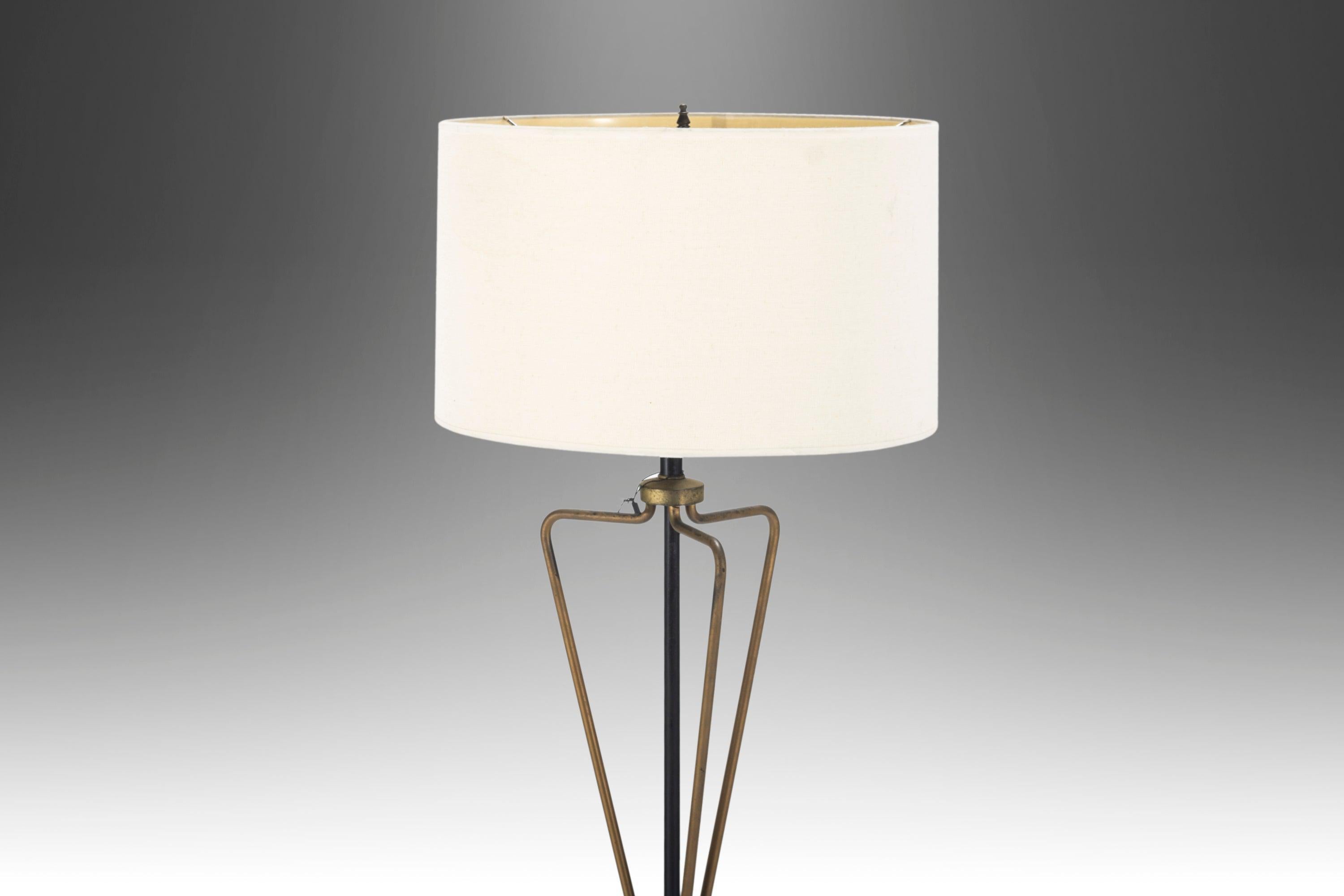 An exquisitely designed mid-century floor lamp blending materials and architectural elements that make it an eye-catching statement piece in whatever room it resides. There's only one. Make it yours today!
 