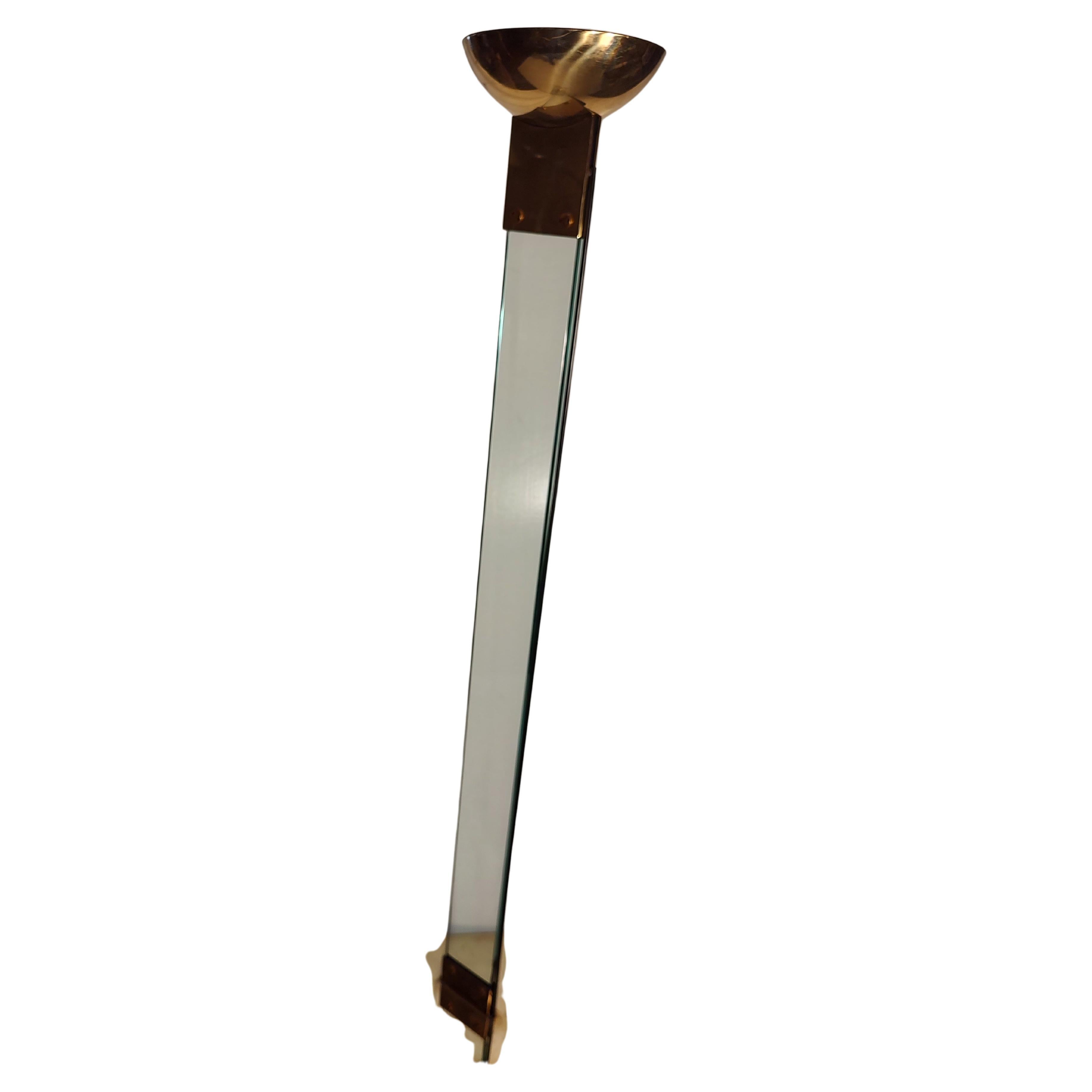 Fabulous and elegant floor lamp designed by Max Buguara. Glass shaft connecting brass elements on a unique style. Some wear to the brass. In excellent vintage condition with minimal wear. Truly a spectacular uplight torchiere. Has a floor switch