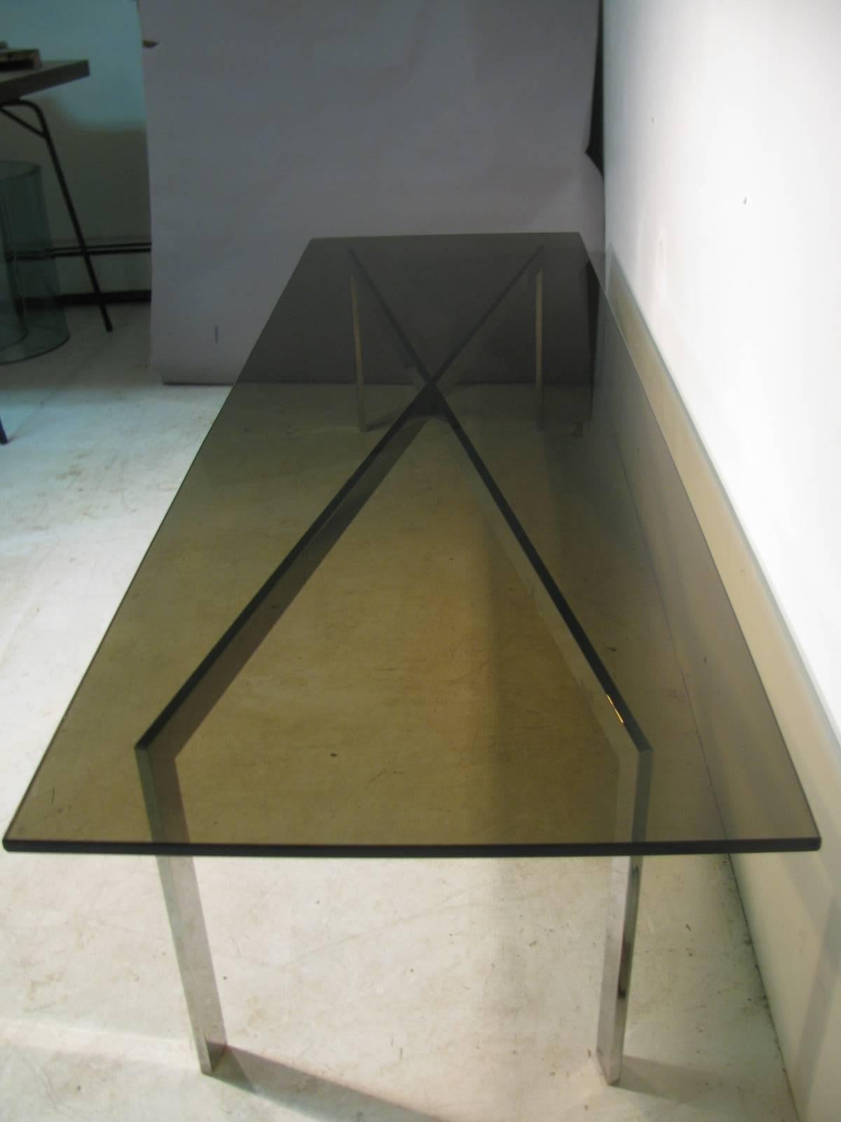 Elegant design in a long (six feet) and clean design. X-stretcher frame in nickel chrome supporting the architectural black smoked glass. Glass is in excellent condition, showing no signs of wear.