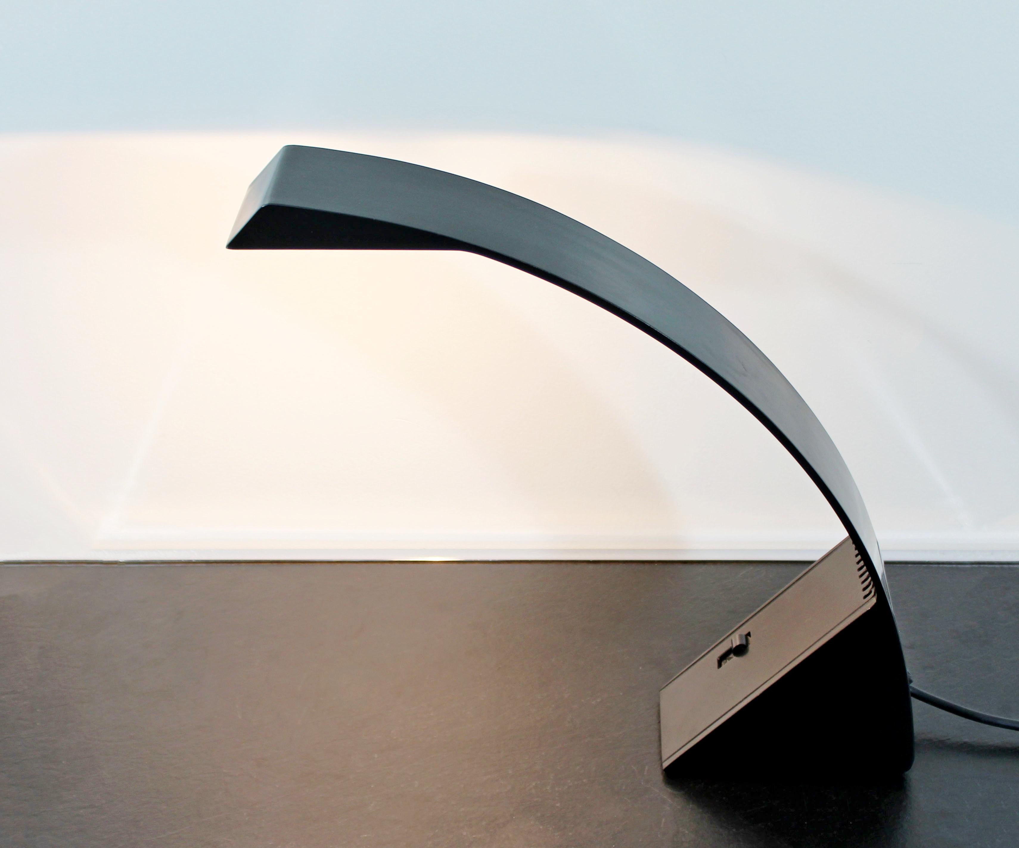 For your consideration is an original, Arcobaleno, curved black enameled aluminium, halogen desk lamp, designed by Marco Zotta for Cil Roma, Italy, circa 1970s. Included in the design collection of MoMA in New York. In excellent condition. The