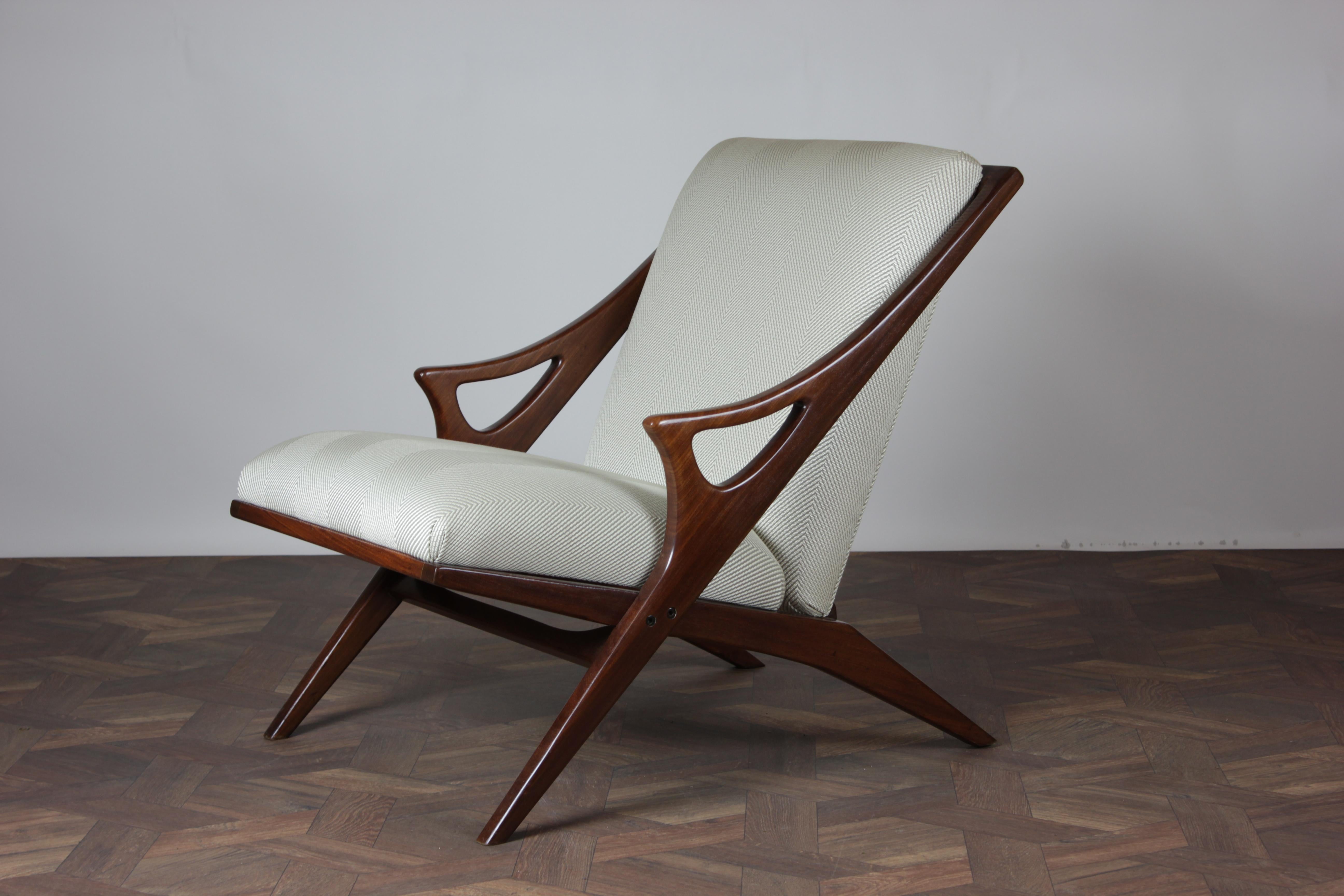 Introducing the Mid Century Modern Armchair by Arne Hovmand-Olsen for Mogens Kold, a timeless masterpiece from the 1950s that has been lovingly restored and newly upholstered to bring its iconic design back to life. This exceptional piece of