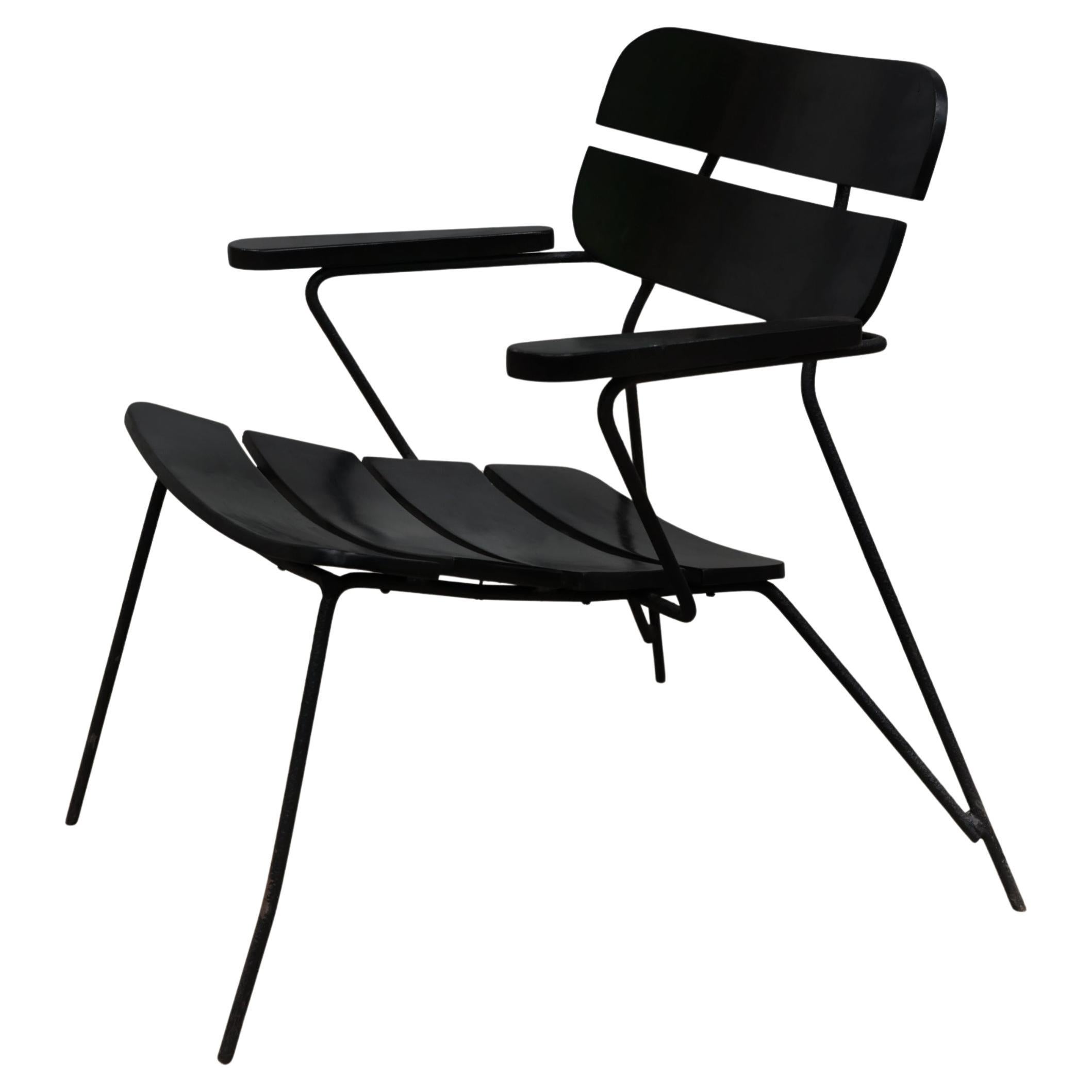 Available today, with domestic shipping in NYC metro area included, this Mid Century Modern Armchair in Metal, Wood & Ebony by Carlo Hauner & Martin Eisler, 1950s nothing less than gorgeous!  

This armchair was designed by Carlo Hauner and Martin