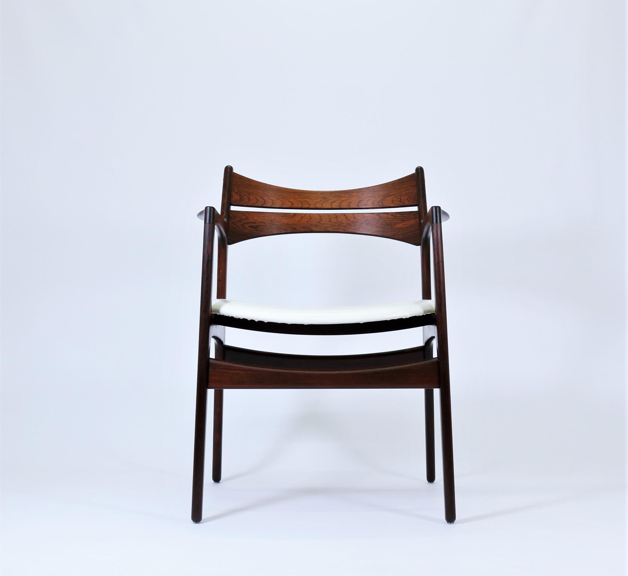 Truly stunning vintage armchair in Brazilian rosewood by renown Danish designer Erik Buck. The chair was made at Chr. Christensen Møbelfabrik in Vamdrup, Denmark in the mid-1960s and is a great example of Danish furniture design from the period. It