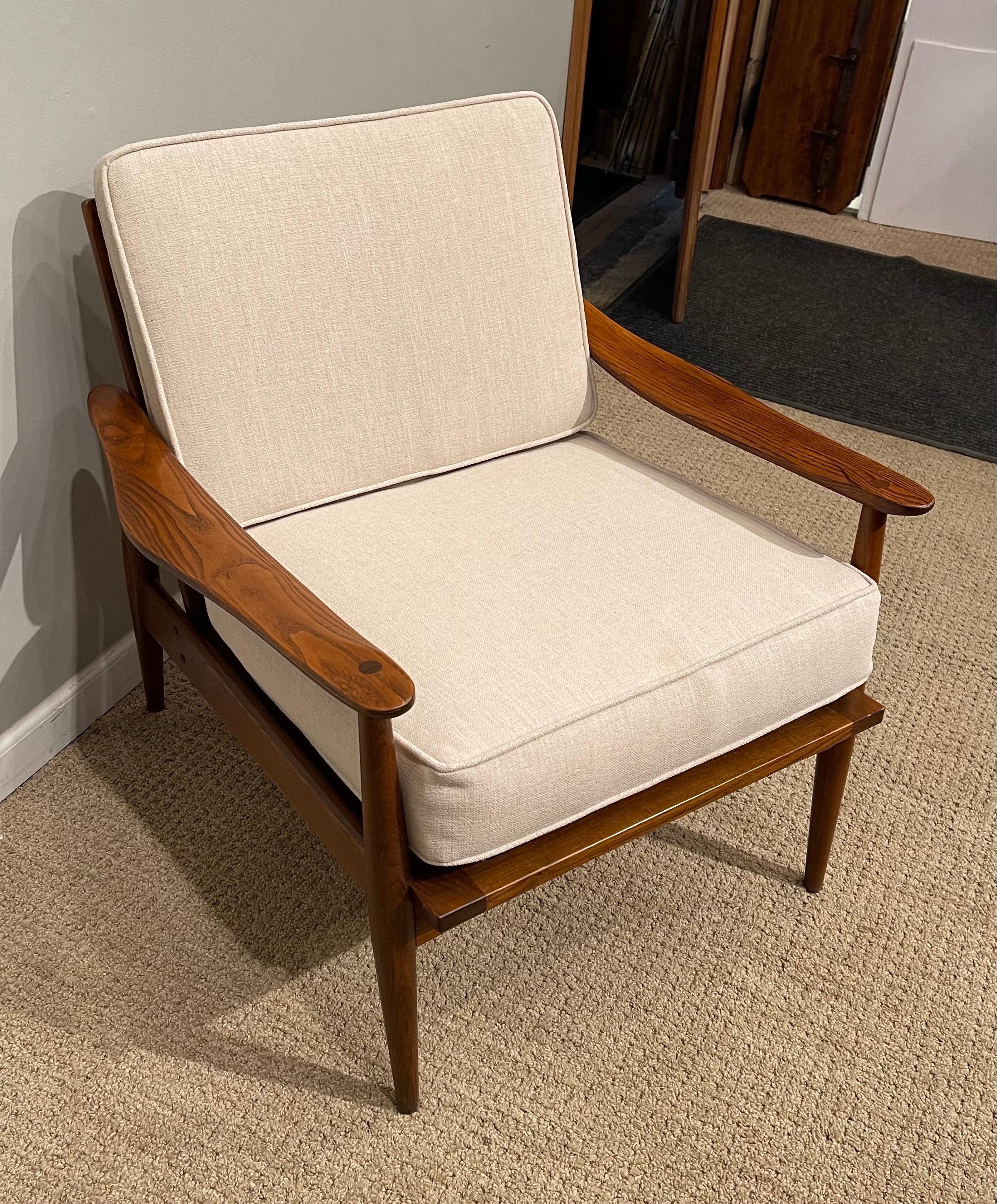 A Mid-Century Modern, oak armchair with new cushions.