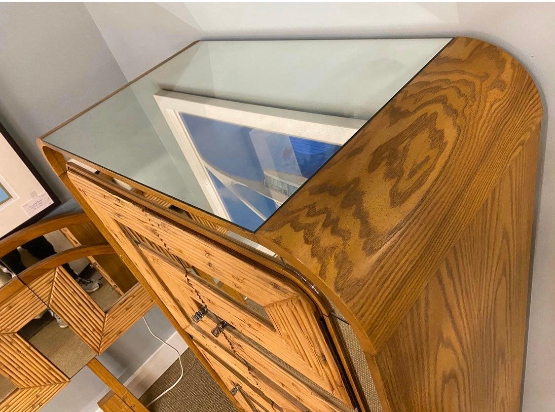 With its elegant lines, including a rounded top, this midcentury bamboo, glass and chrome
case piece makes a lasting impression. This iconic piece can be used as a bar, wardrobe, entertainment unit or sideboard,
among other options.

 