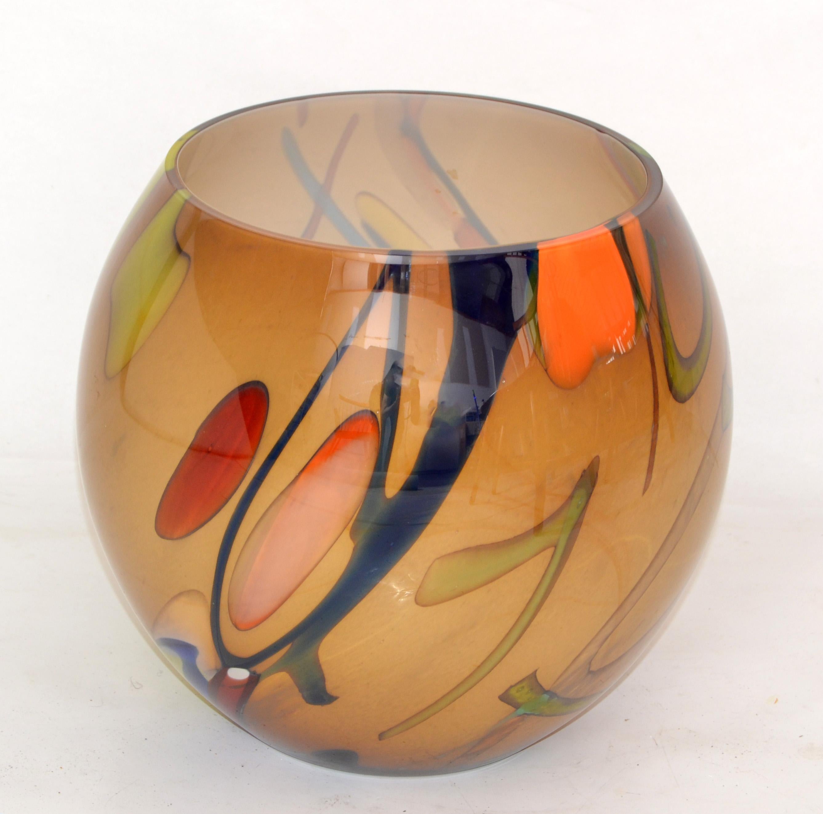 Heavy beautiful white encased round art glass Vase or Bowl in hues of brown, orange and green. 
Comes from the Eastern European Polish Nation, marked at the base, handmade in Poland.
Beautifully crafted and flowing color brilliance.