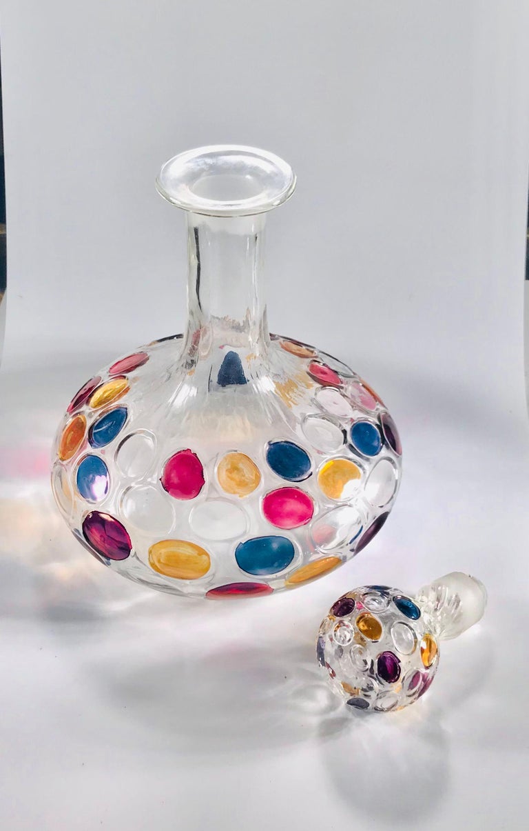 Simply Fabulous! Mid Century Modern Original Art Glass Decanter and stopper featuring striking colorful Thumbprint designs. Measuring approximate 10.5” high. Circa 1960s. So well done. For that Special Someone...including You!