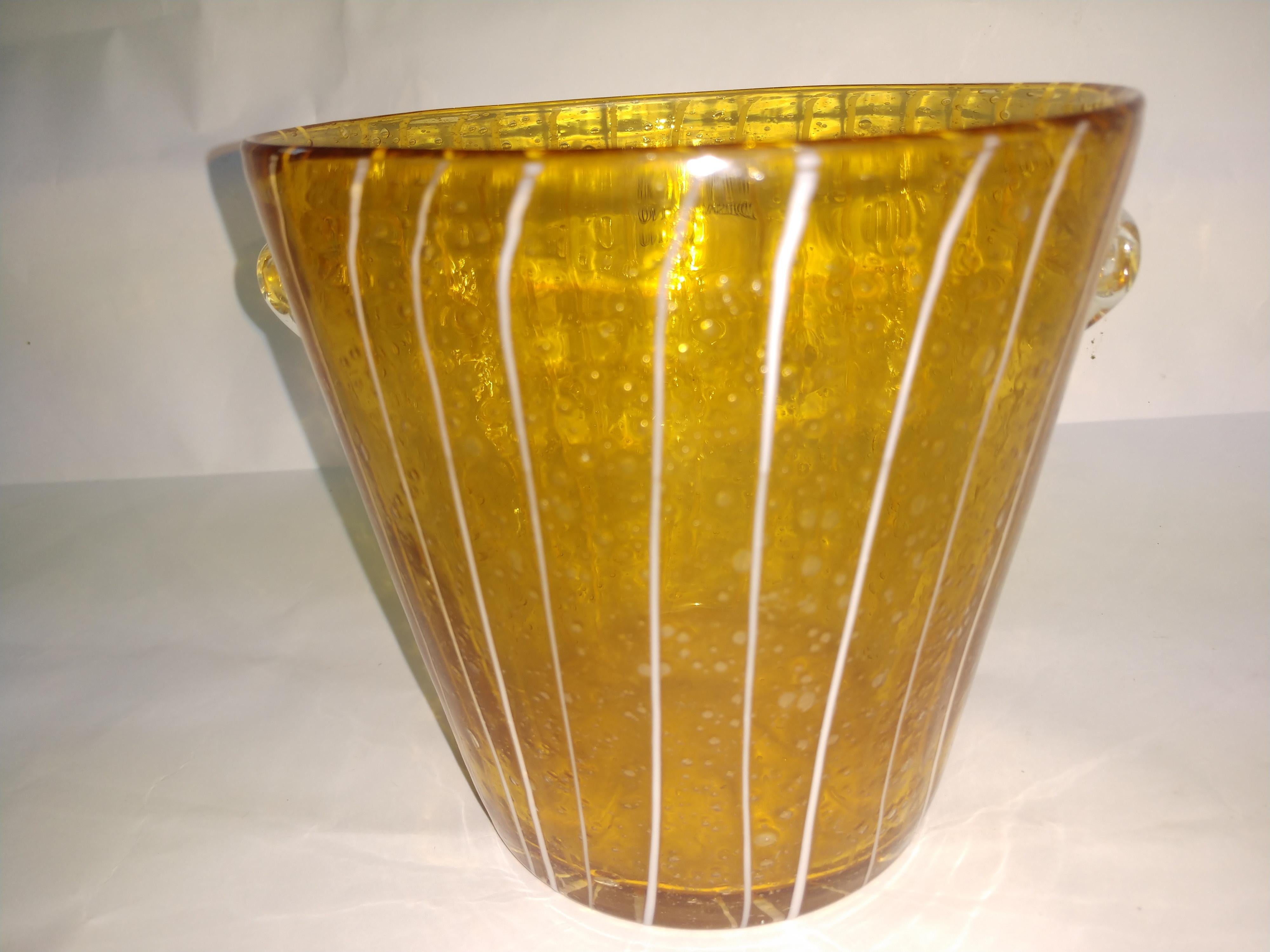 Striking art glass vase ice bucket by Venini for Disaronno. Beautiful amber glass with a white striped drizzle.