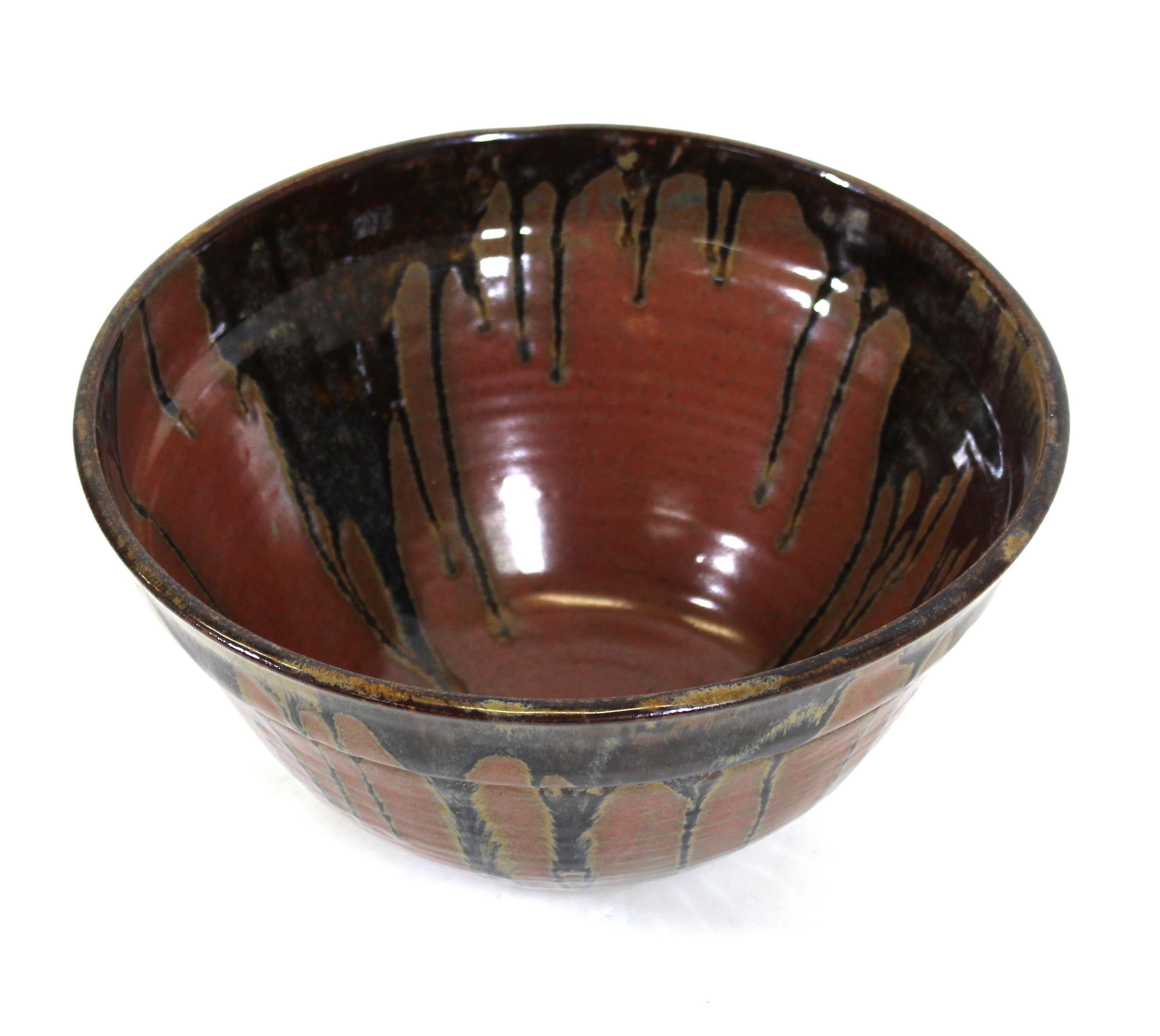 Mid-Century Modern art Studio Pottery bowl with Kaki-style glaze, possibly Japanese, signed on bottom.