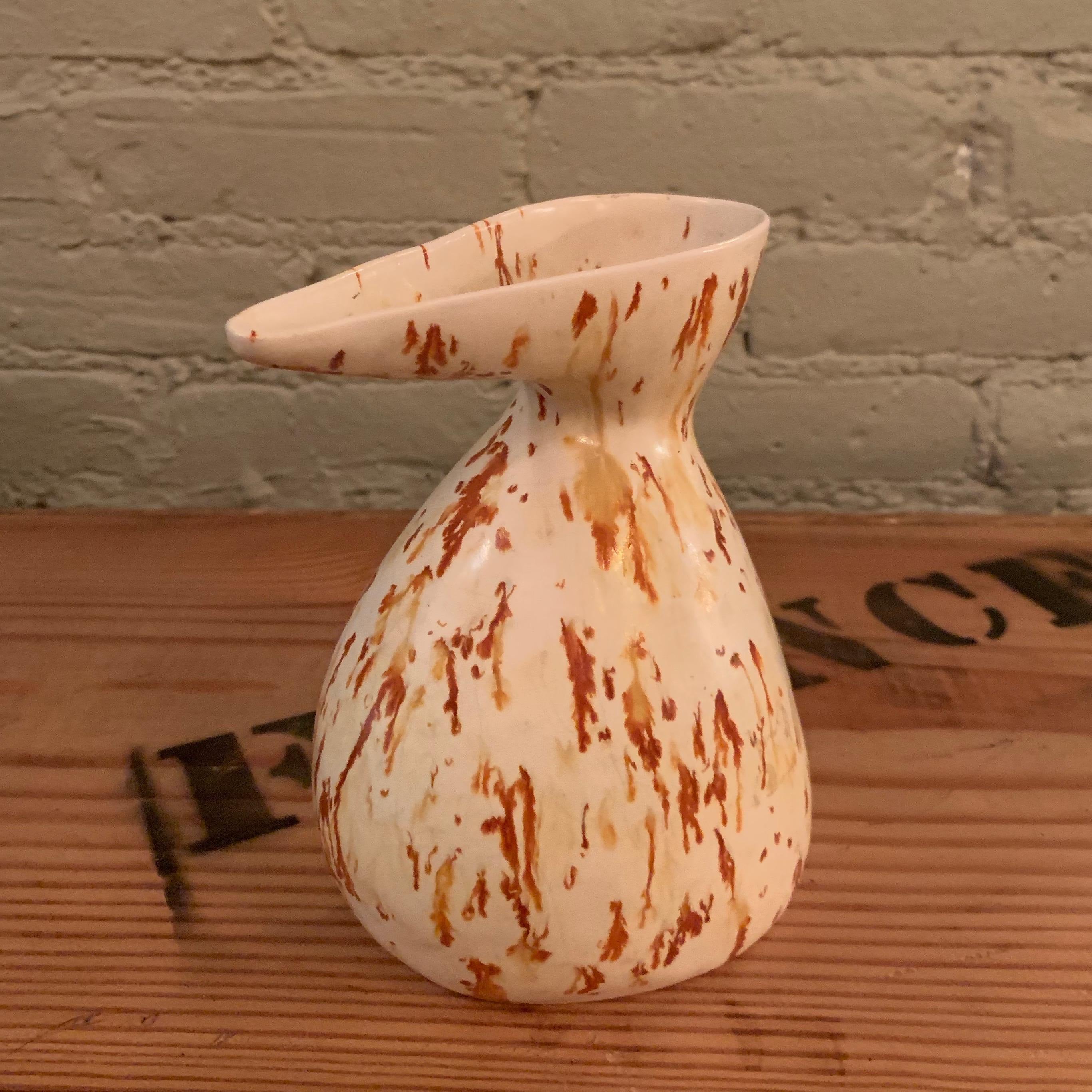 Mid-Century Modern, art pottery, ceramic vase or decanter features splashes of tan and orange.