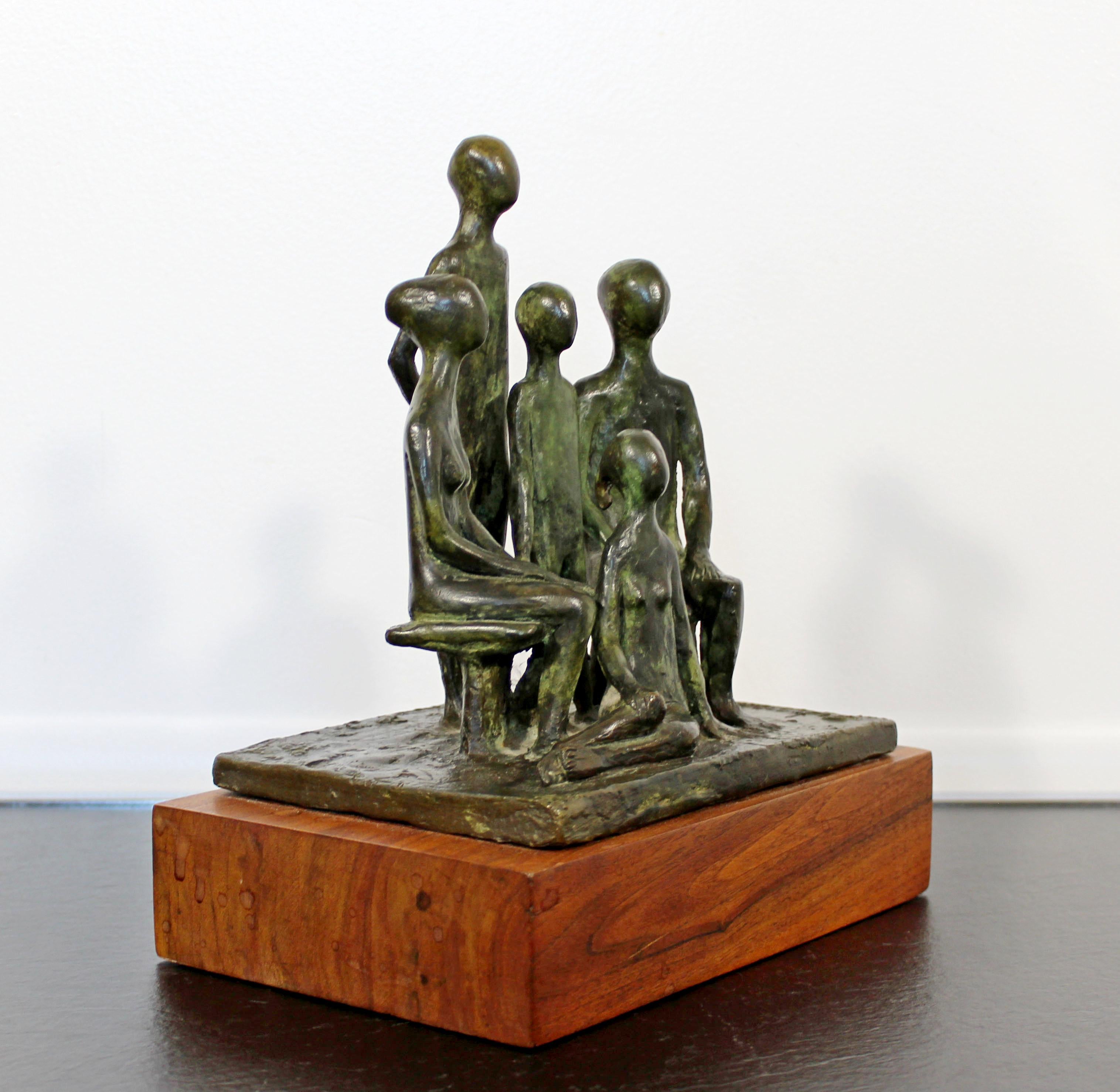 For your consideration is a wonderful sculpture of a family, made of bronze on a wood base, signed by Arthur Schneider, circa the 1970s. In excellent condition. The dimensions are 8.5