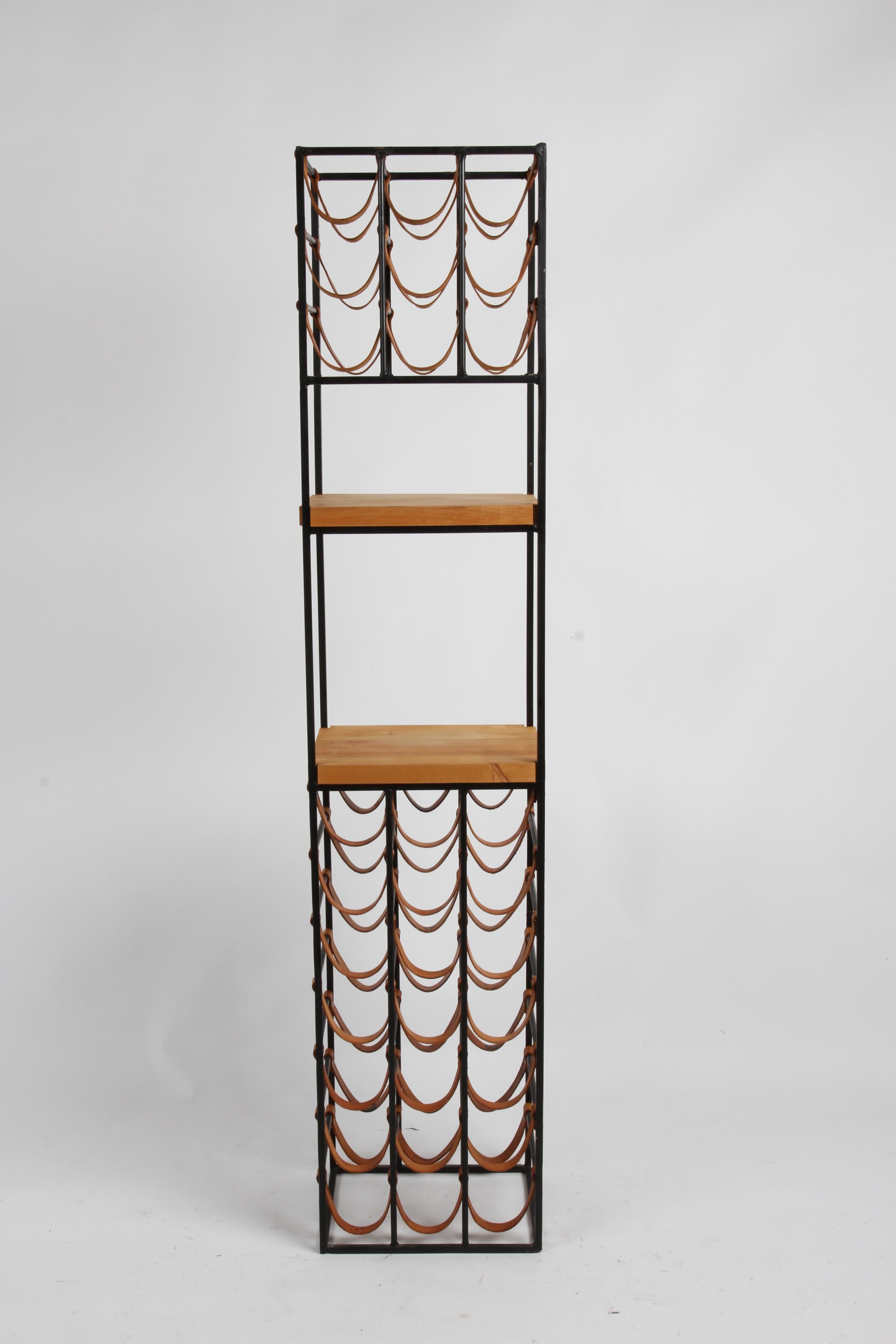 Mid-Century Modern Arthur Umanoff tall 30 bottle wine rack with two butcher block shelves for Shaver Howard. Butcher block tops were sanded and tung oil applied , leather straps were cleaned, treated with leather conditioner and are solid, some have