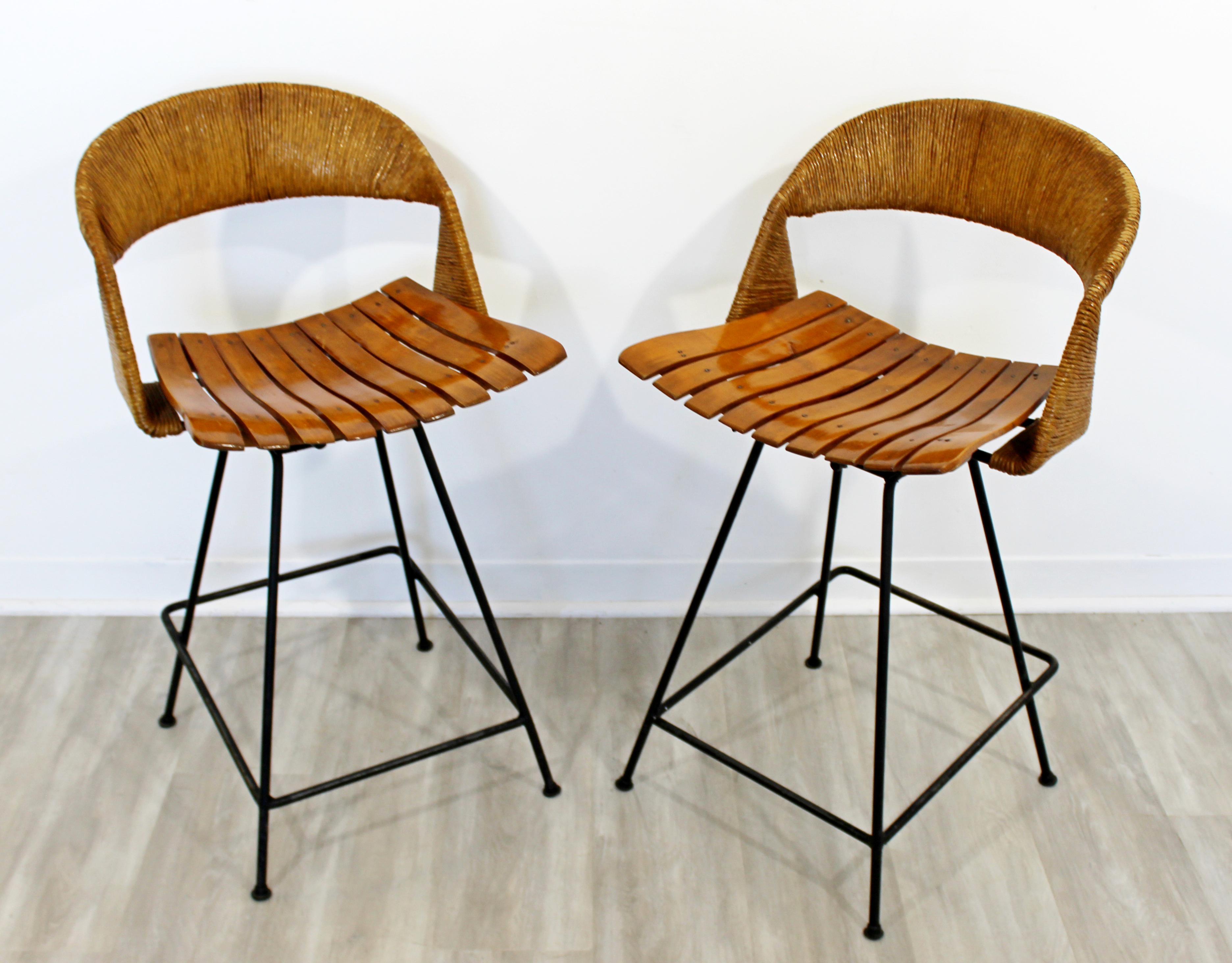 For your consideration is a ravishing pair of counter height bar stools, by Arthur Umanoff, circa 1960s. In very good vintage. The dimensions are 18