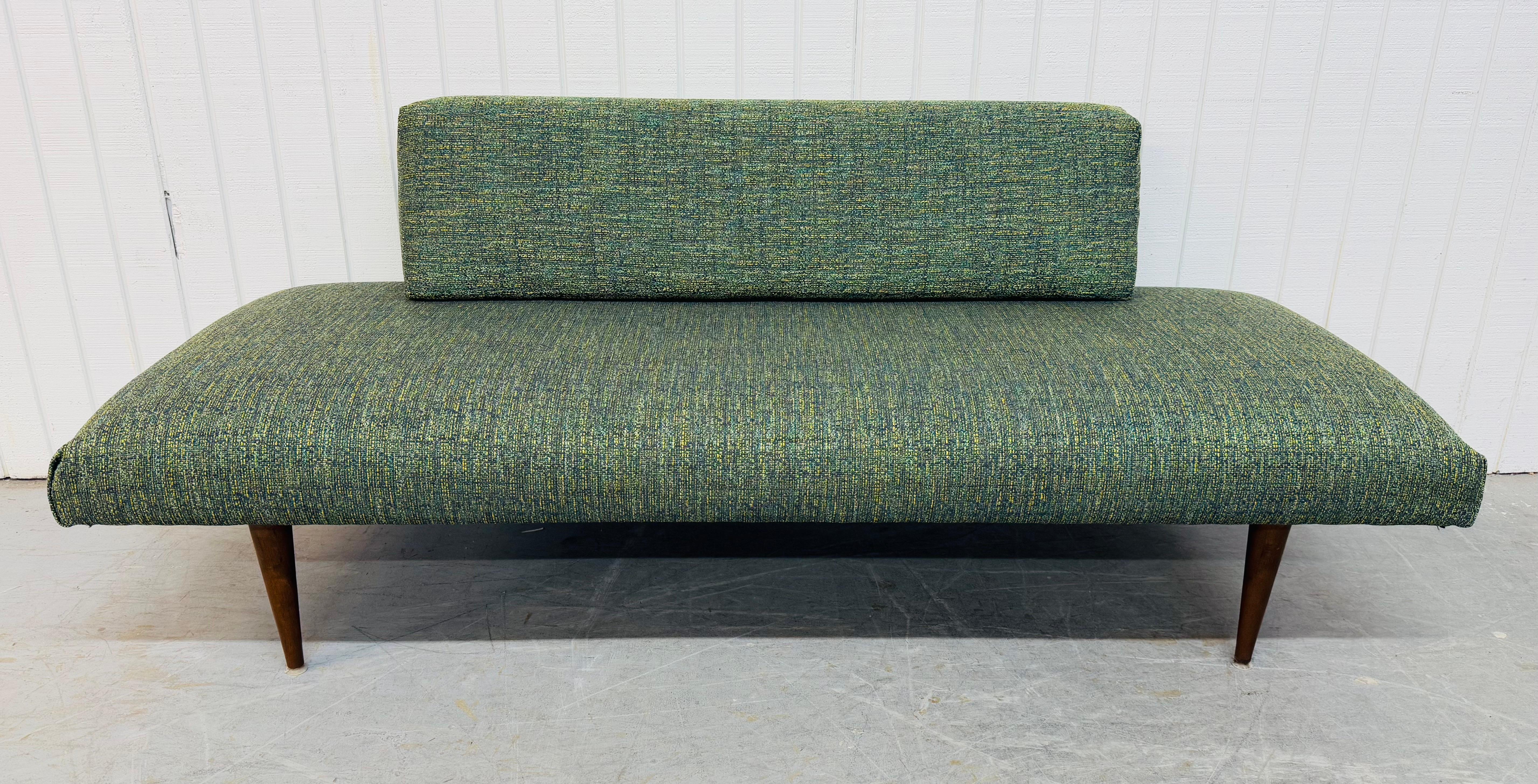 This listing is for a Mid-Century Modern Day Bed in the style of designer Arthur Umanoff. Featuring new upholstery, wood/iron construction, and four modern walnut legs. This is an exceptional combination of quality and MCM design! 