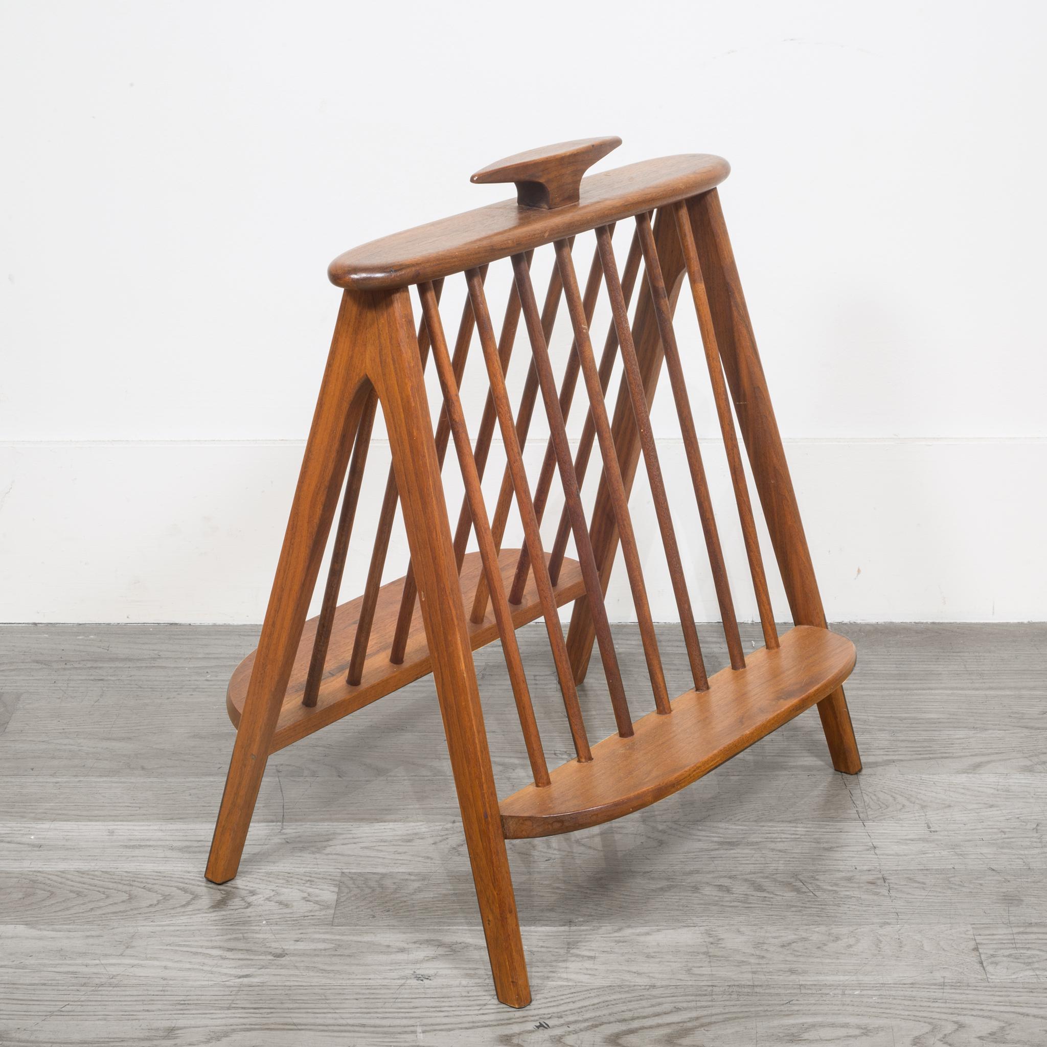 About

A Mid-Century Modern sculpted walnut record holder/magazine rack designed by Arthur Umanoff. The piece is solid walnut with a sculpted top handle. It is sturdy and in very good original vintage condition with minor wear from age and