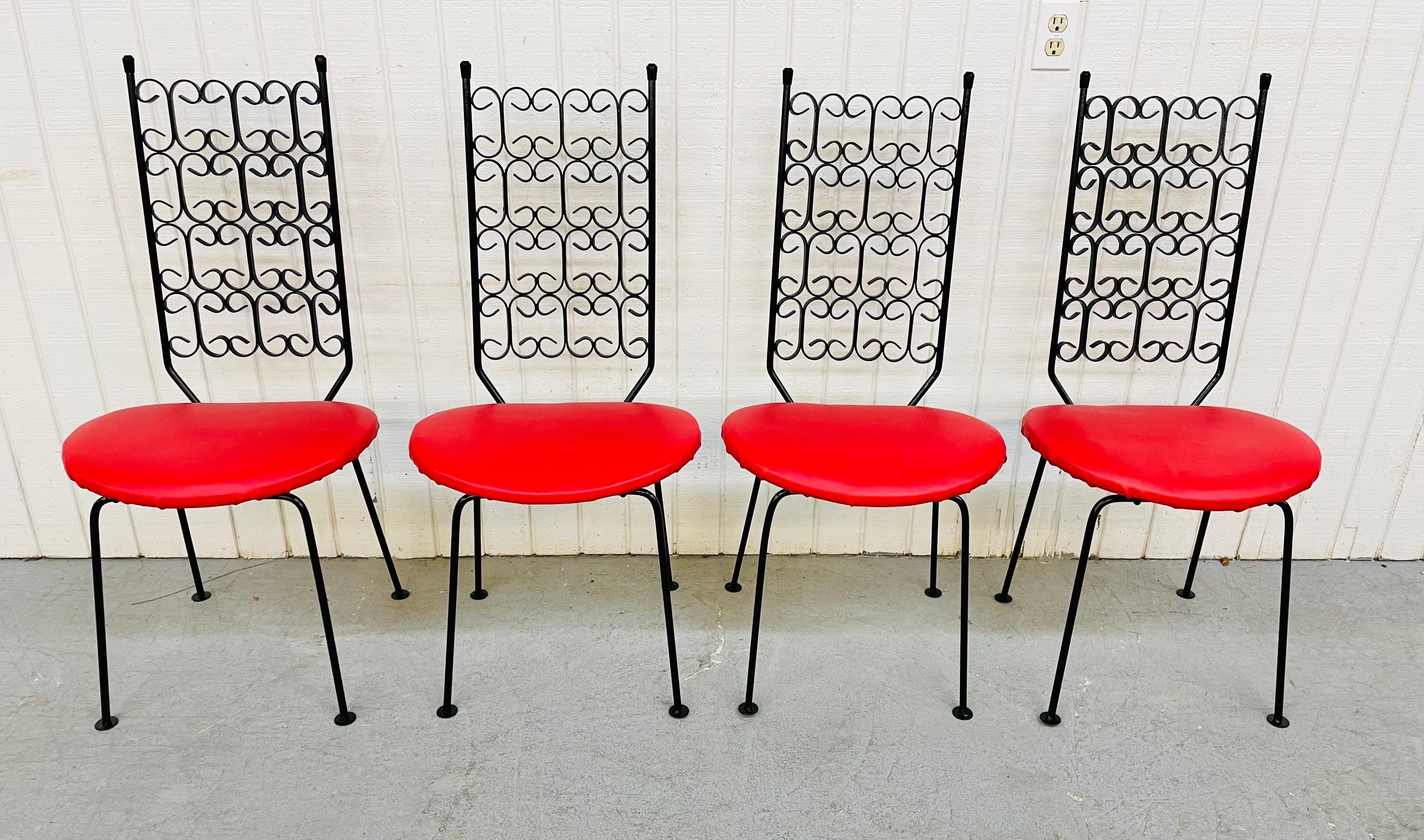 This listing is for a set of four Mid-Century Modern Arthur Umanoff wrought-iron Patio chairs. Featuring four black armless wrought iron chairs, blood red vinyl upholstery, and a beautiful twisted iron designed back rest.
