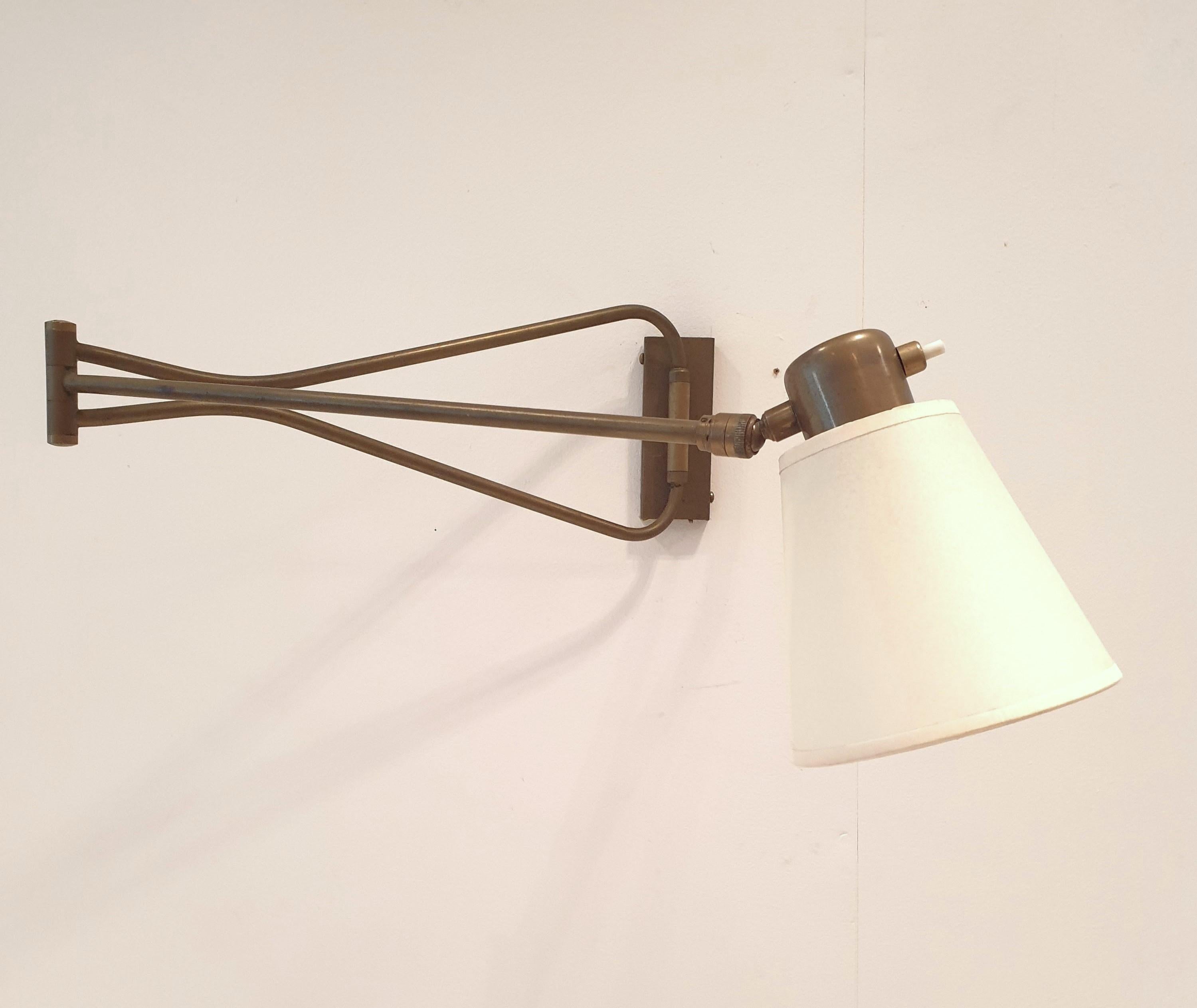 French Mid Century Modern articulated wallight. For Sale