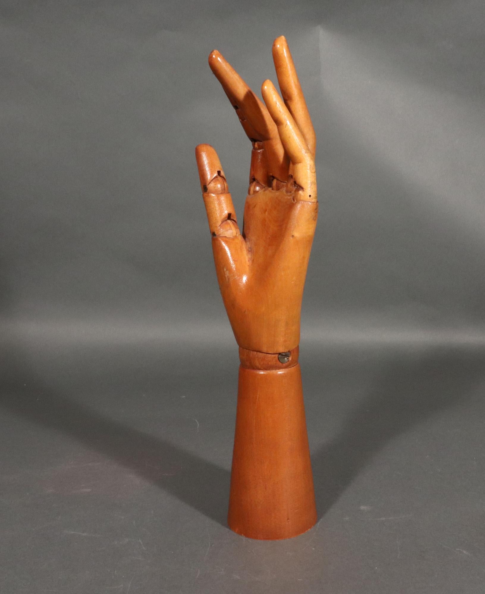 Articulated Wood Artist Hand Model,
1950s

The carved light wood hand is articulated at the wrist and the base of each finger while the forefinger and thumb are also articulated at the knuckle and the other fingers each have a slight natural bend. 