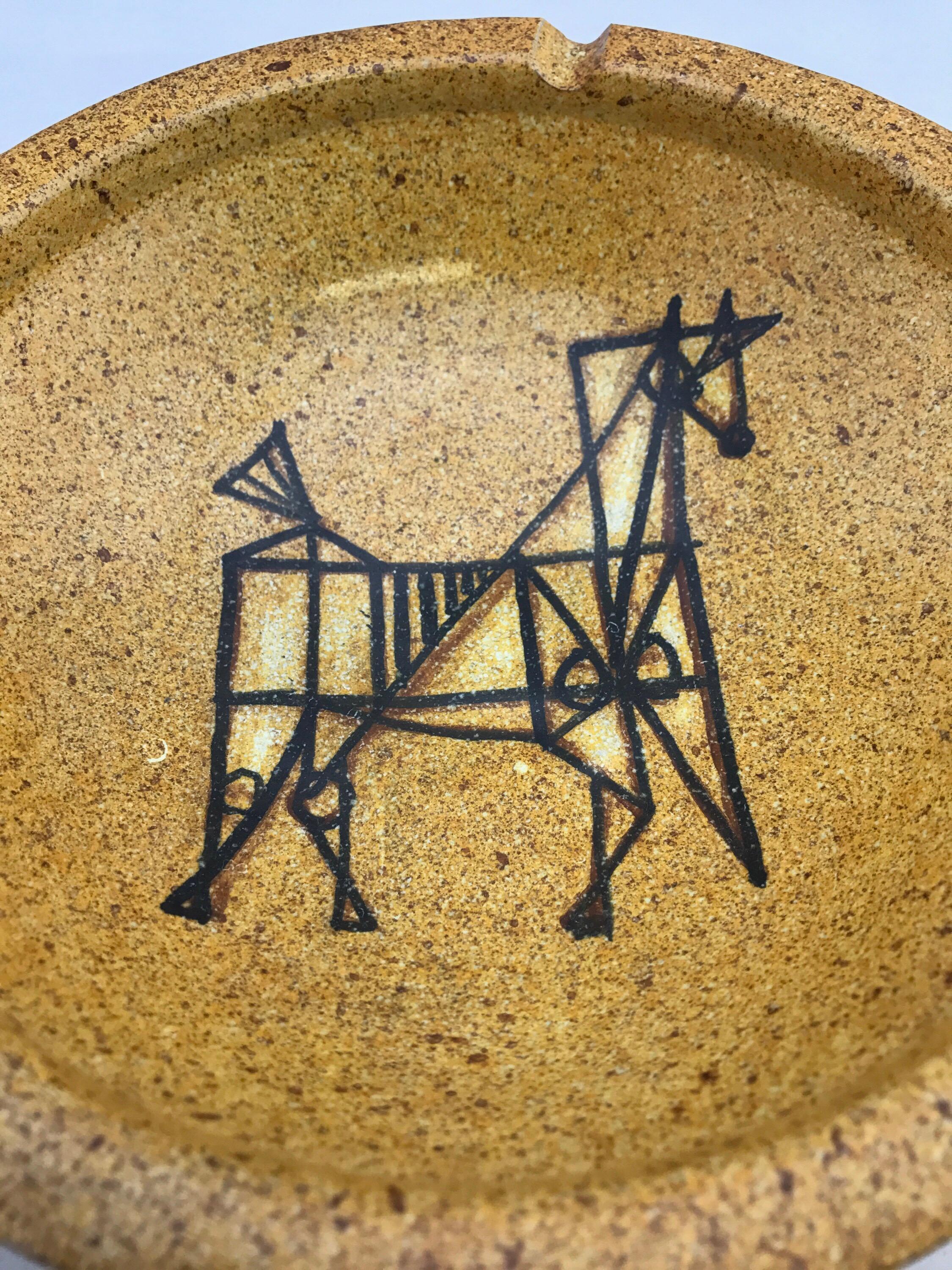 Mid-Century Modern ashtray or bowl by Alfaraz Spain, yellow glaze with modernist horse. Above average condition with minimal signs of use. No other known issues that would detract from value or aesthetics.