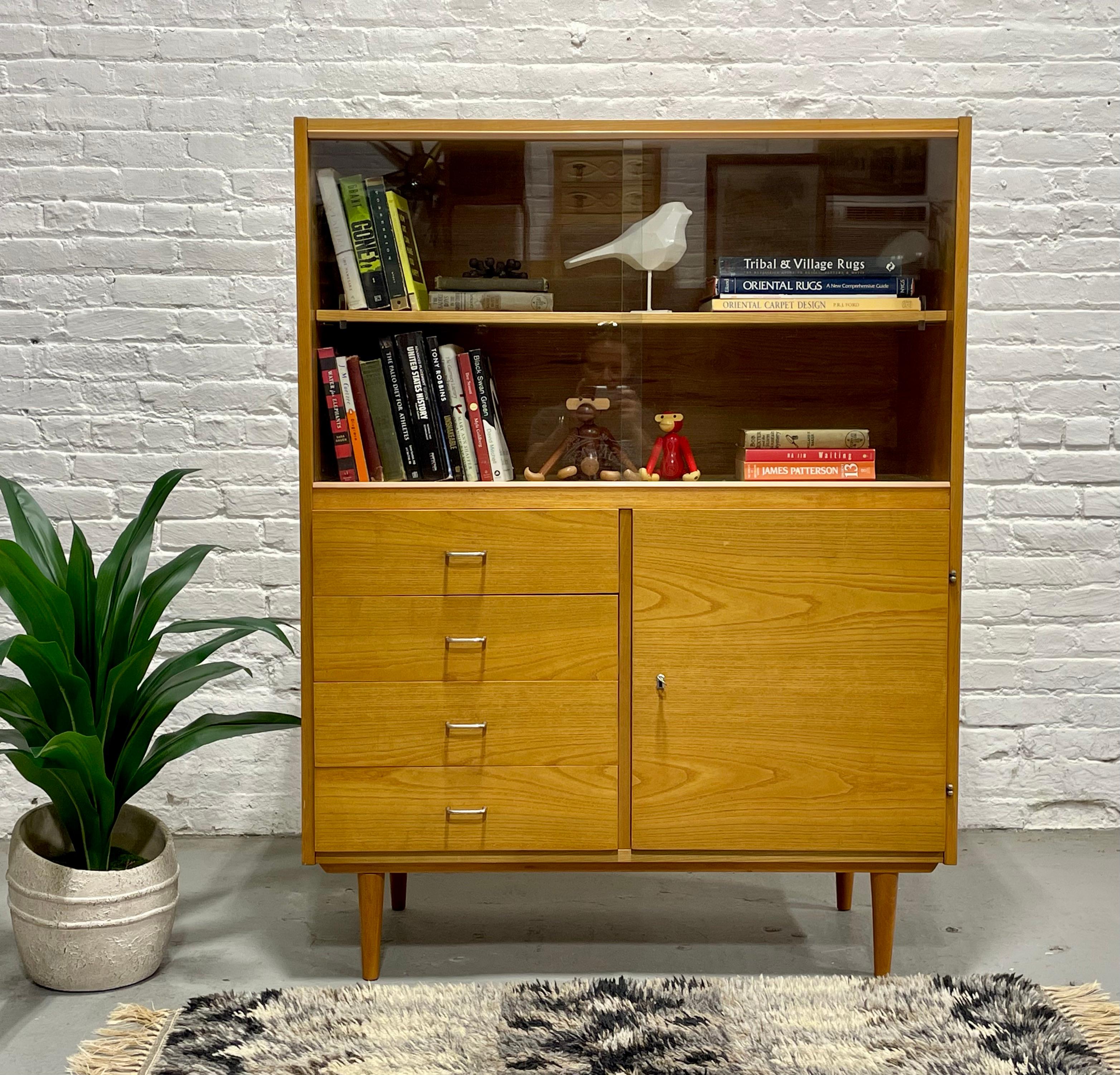 Mid Century Modern Ashwood Bookcase / Liquor Cabinet, by Jitona Sobeslav for Up Zavody, c. 1960’s.  This classically styled piece is reminiscent of Paul McCobb’s styling and offers a perfect combination of drawer storage as well as adjustable