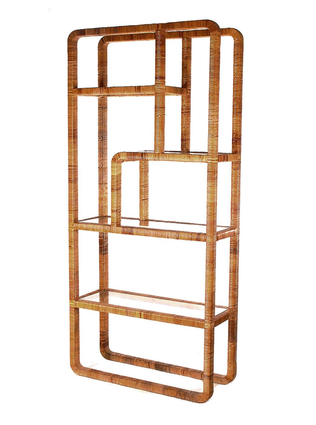 A 1970's retro classic etagere. It consists of rattan wrapped wood framing with clear glass shelves. Overall in excellent condition.