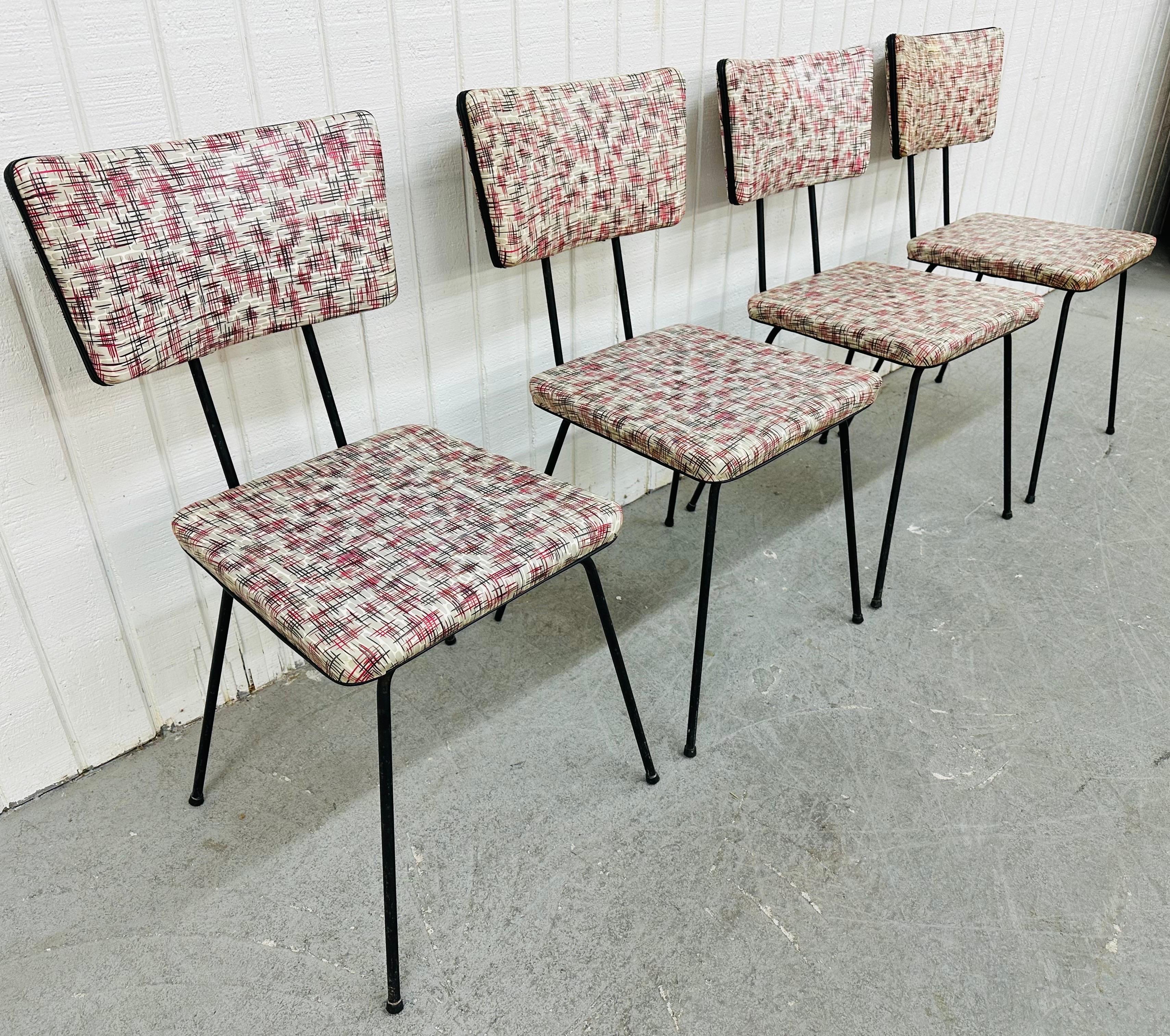 This listing is for a set of four Mid-Century Modern Atomic Dining Chairs. Featuring a black hairpin frame, atomic vinyl upholstered seat and backrest. This is an exceptional combination of quality and design!