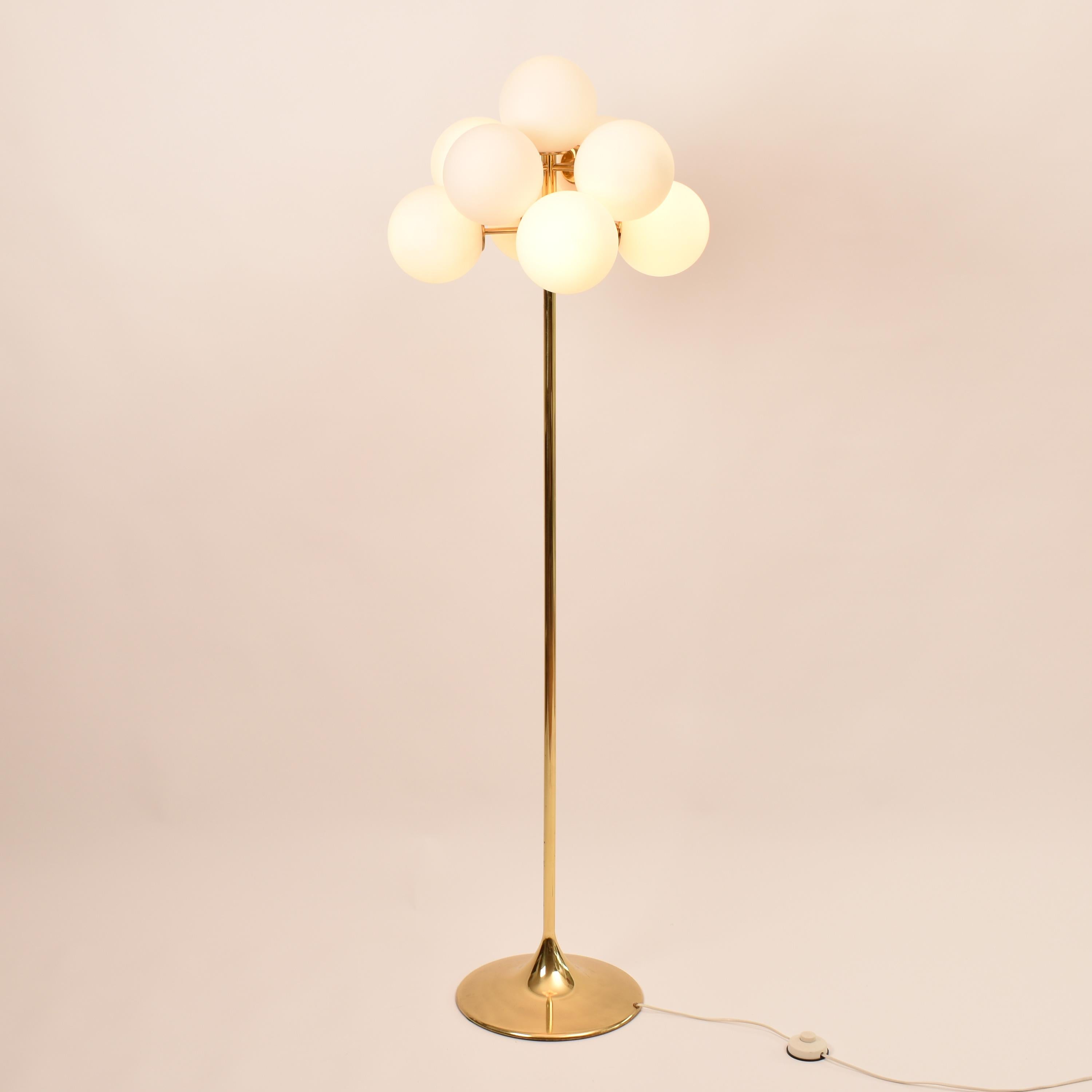 This floor lamp sputnik is a real statement piece, chic and elegant.
Designed by Eva Renée Nele Bode, artist and designer born in Germany in 1932 ( often attributed to Max Bill ), manufatured by Temde Leuchten, Switzerland.
The cloud of nine hand