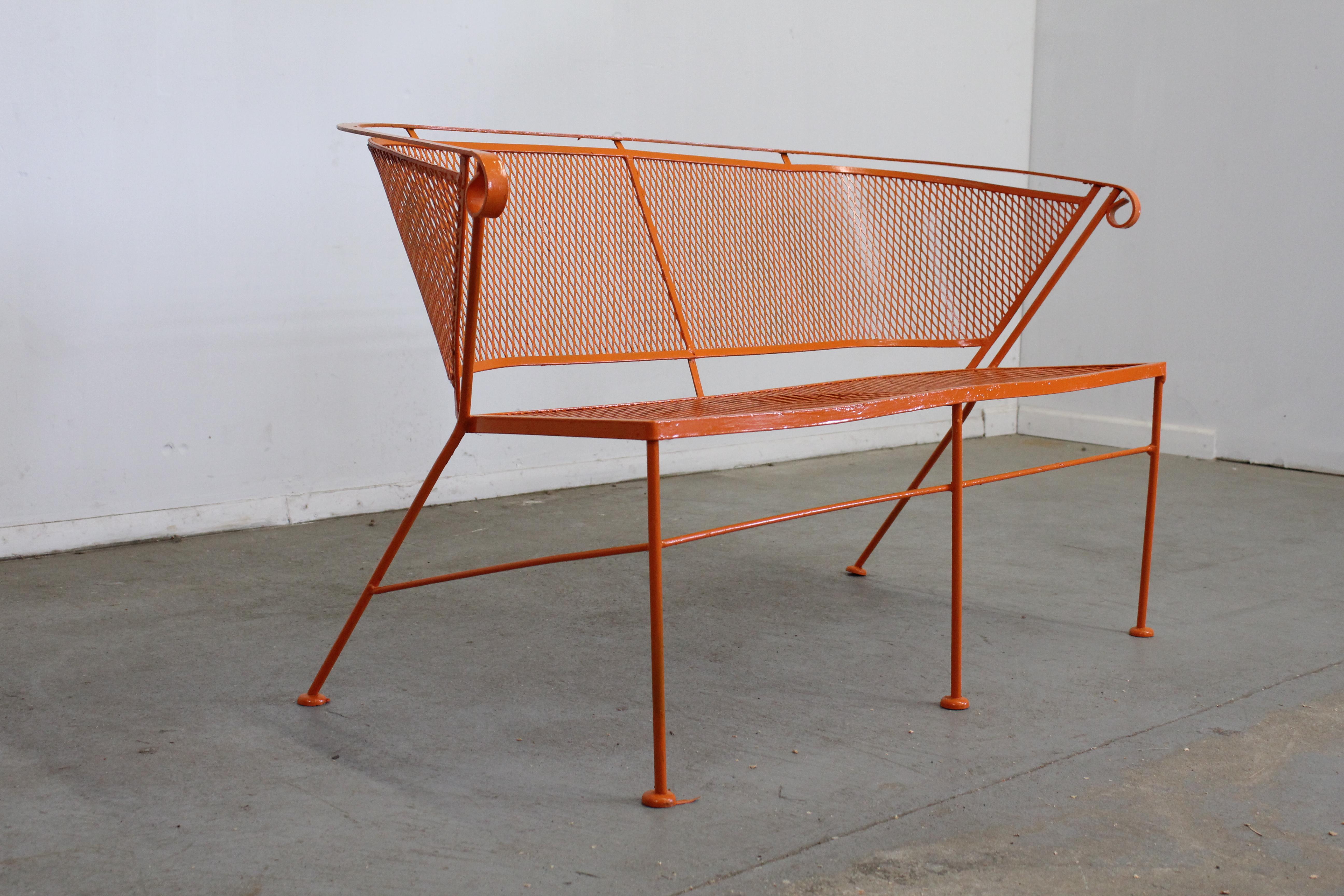 Mid-Century Modern atomic orange outdoor metal curved back bench

Offered is a Mid-Century Modern atomic orange outdoor metal curved back bench, circa 1968. This bench has been repainted in an atomic orange. It is in good condition considering the