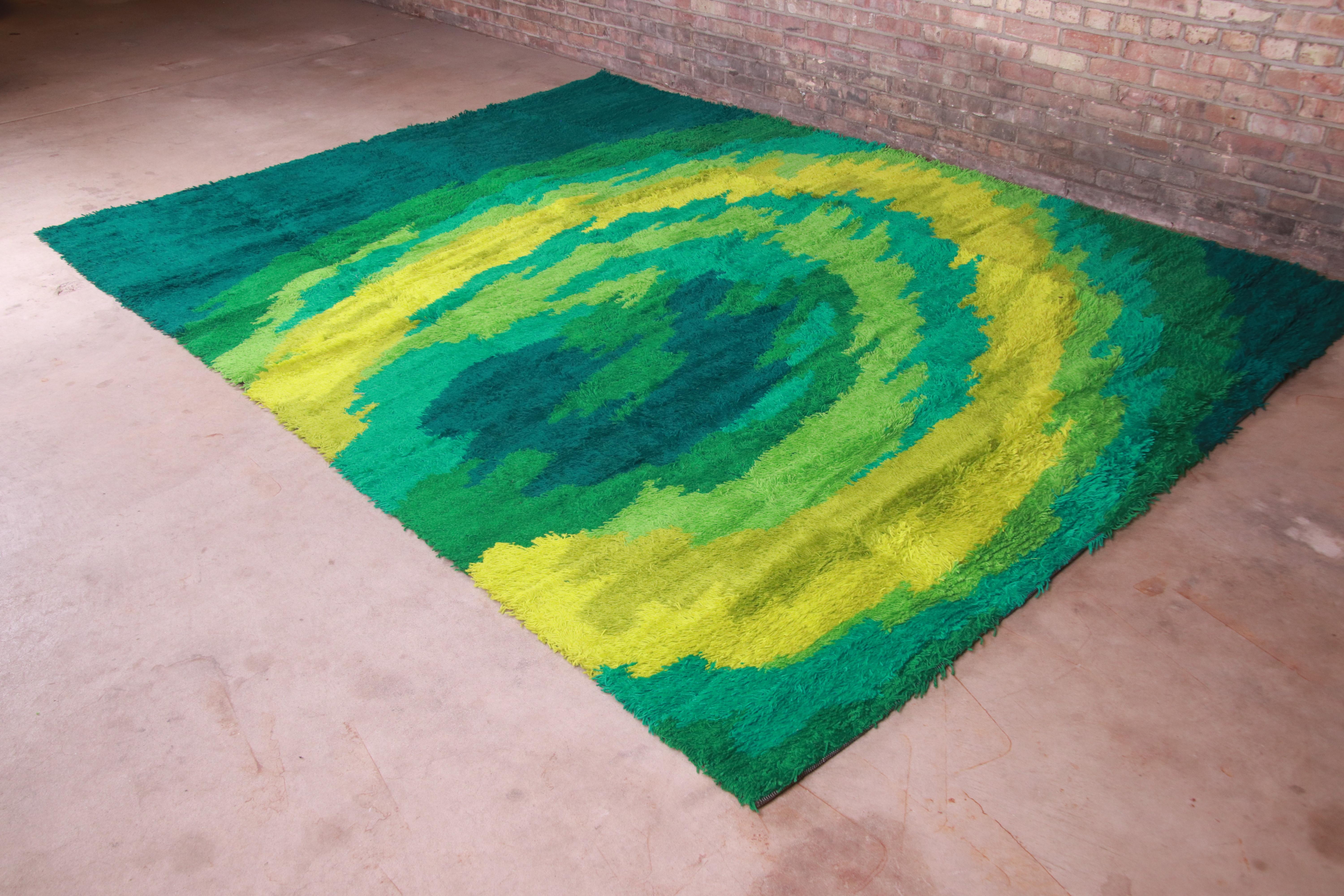An outstanding mid-century Danish Modern style Rya shag wool rug

Produced by Thor for The Fritz and LaRue Co.

Austria, 1970s

Thick wool pile, with vibrant colors in various shades of green.

Measures: 8'2