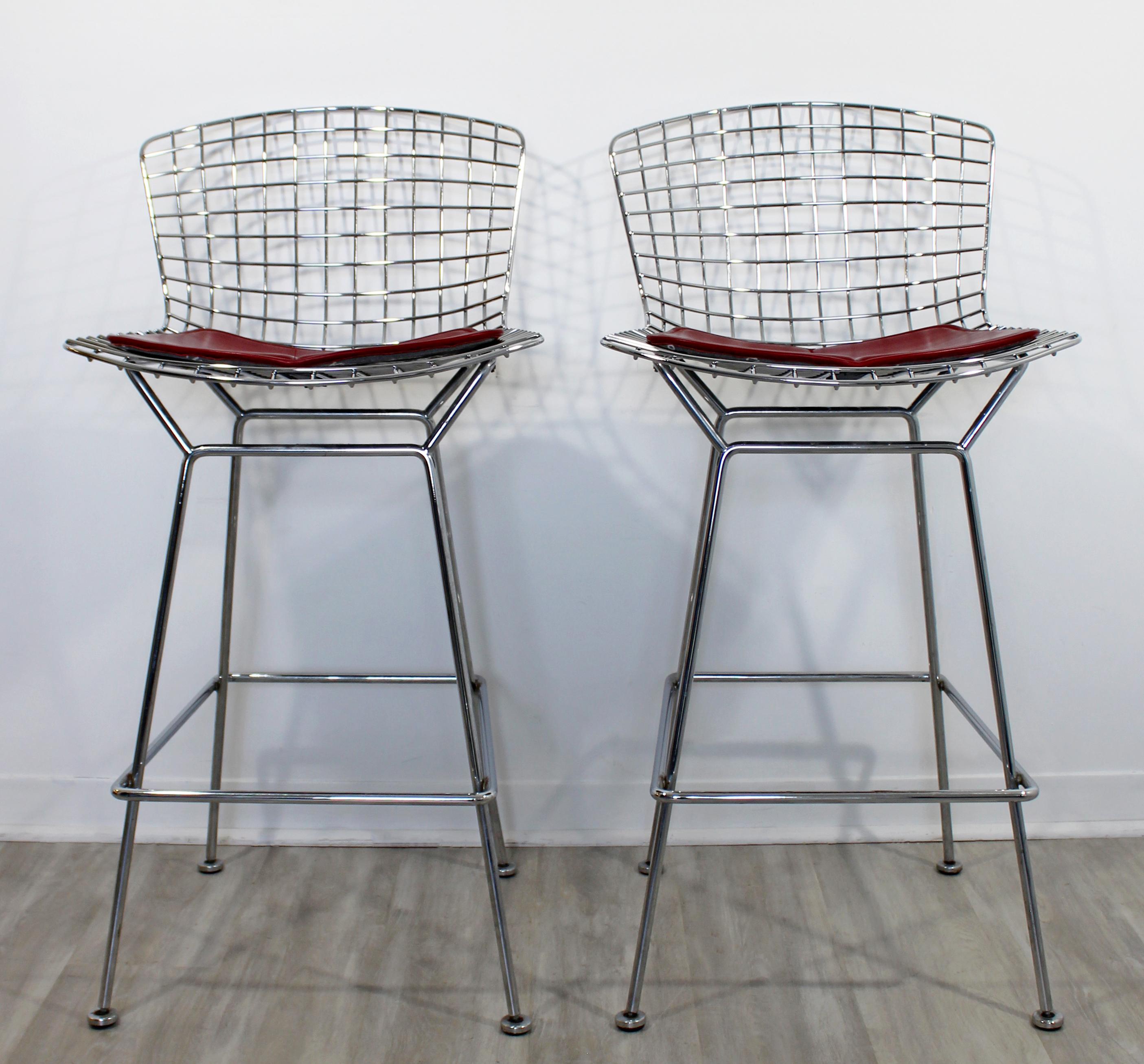 For your consideration is an industrial style, pair of chrome wire bar stools, with red seats, by Knoll, circa the 1970s. In excellent vintage condition. The dimensions are 21