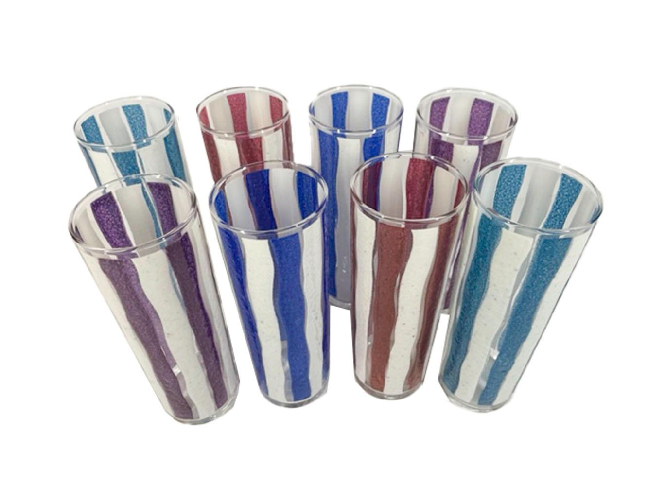 Mid-century Tom Collins glasses by Libbey Glass having fused glass awning stripes in opaque white and translucent color. Two each of four colors.