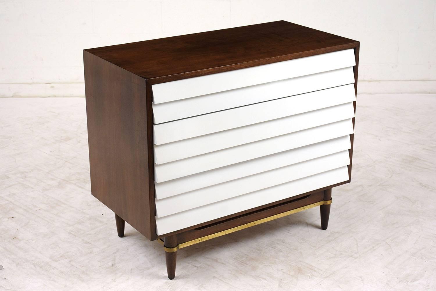 This 1960s Mid-Century Modern Style Bachelor Chest was designed by Merton L. Gershun for American of Martinsville 