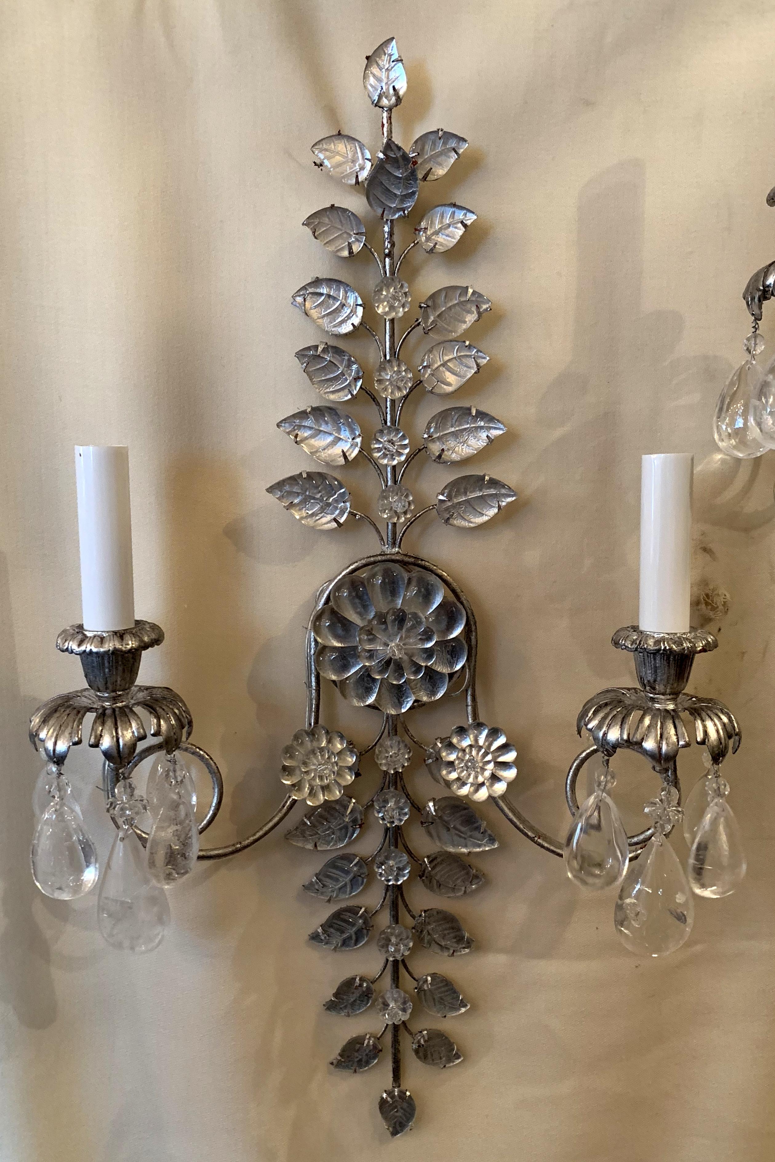 A fabulous pairs of French silver leaf and flower medallion beaded crystal and rock crystal two-arm sconces in the Mid-Century Modern manner of Baguès.
Rewired with new socket and ready to enjoy.
 