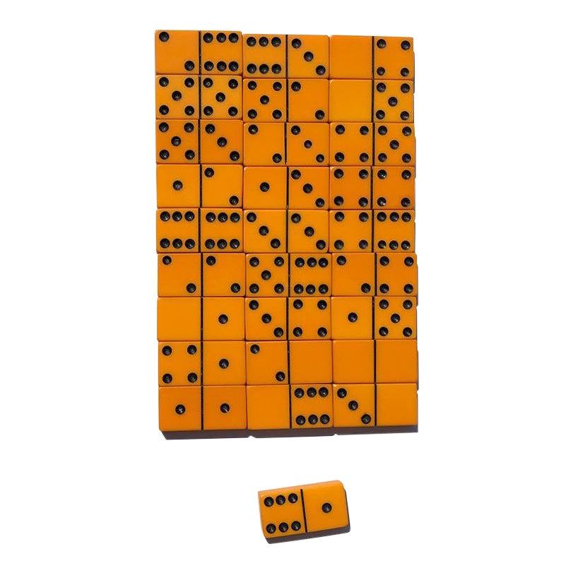 Set of beautiful bakelite dominos. Perfect for game nights or even for display. Comes packed in the original box. Pieces feature black dots on a yellow background. A gorgeous vintage set for any game enthusiast.