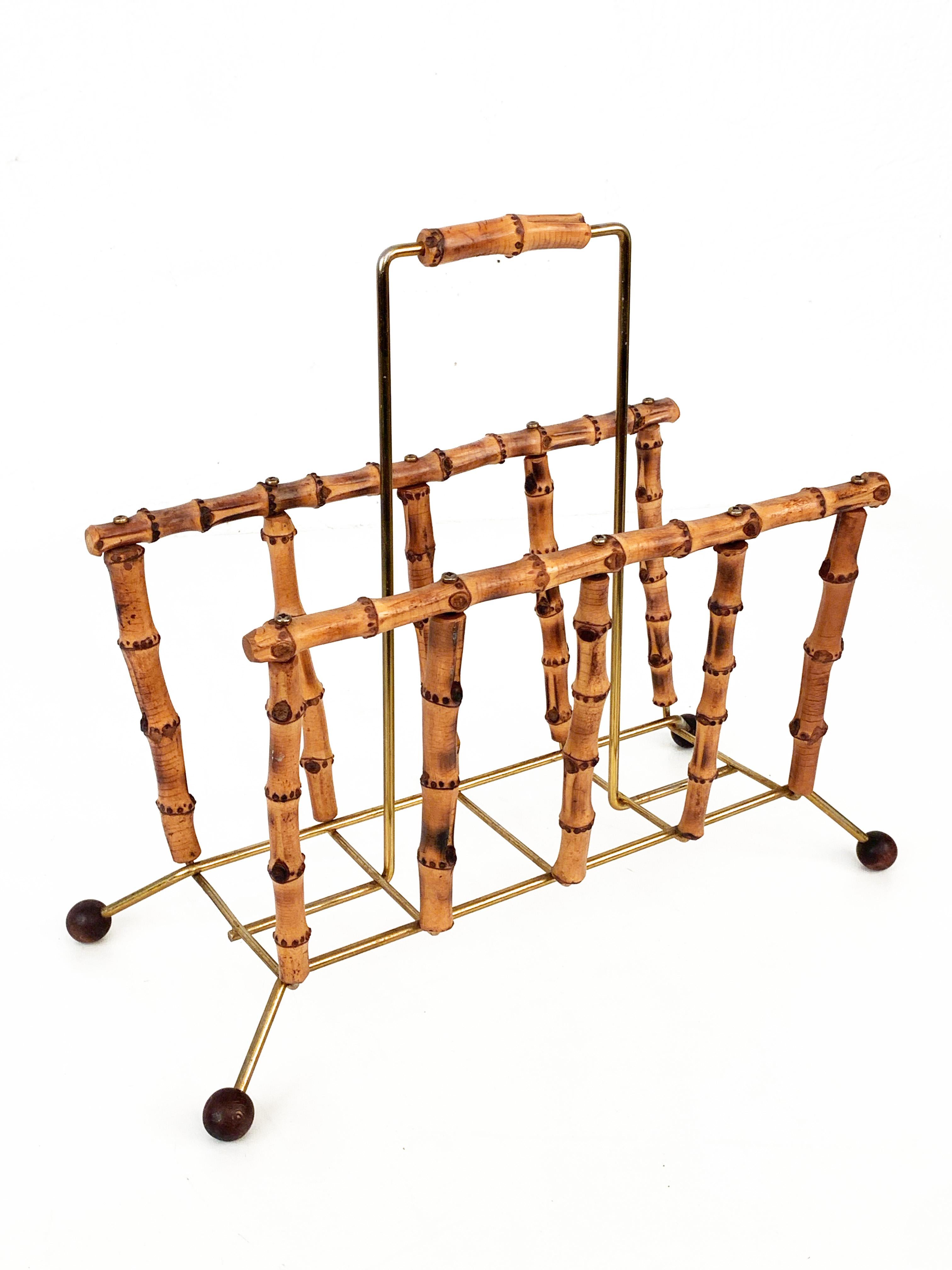 Amazing Mid-Century Modern bamboo and brass magazine rack. This wonderful item was made in France during the 1960s.

A fantastic umbrella stand made of bamboo with a gilded brass structure. The feet are made of bamboo balls.

This marvellous