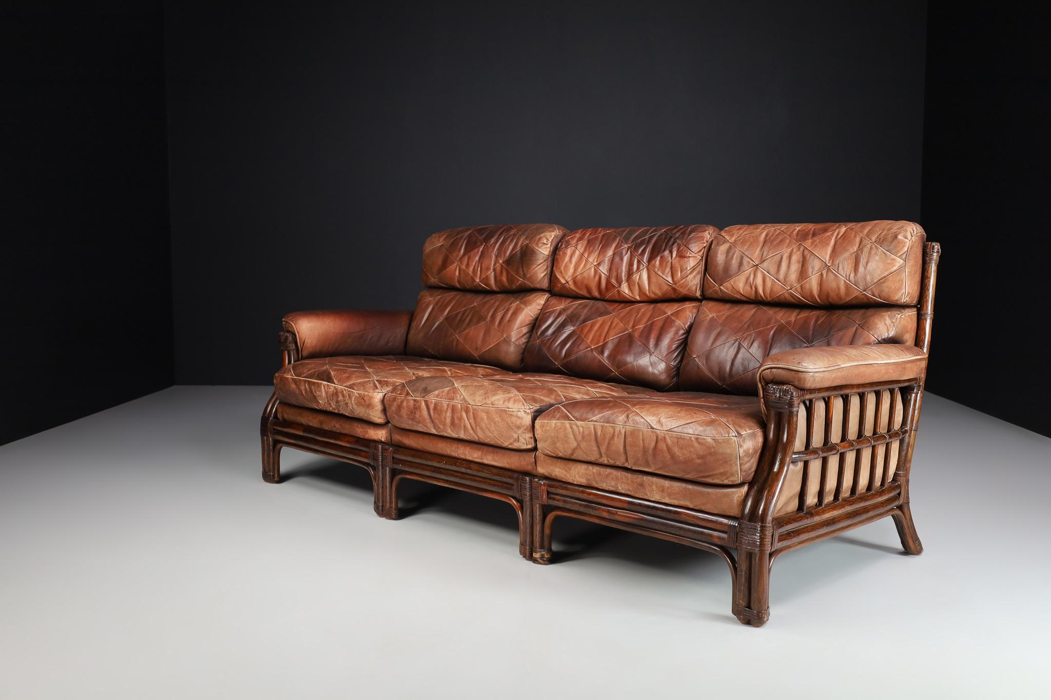 Mid-Century Modern bamboo and leather sofa, France 1970s.

This French sofa was made of bamboo and leather in France in 1970. And would be an eye-catching addition to any interior, such as a large living room, screening room, or office. It also