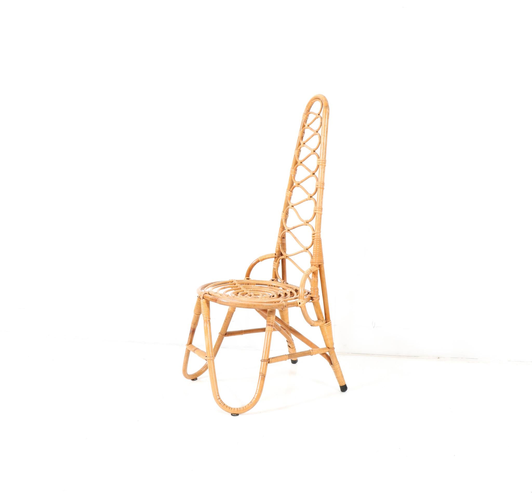 Stunning and elegant Mid-Century Modern high backchair.
Design by Dirk van Sliedrecht for Rohe Noordwolde.
Striking Dutch design from the 1960s.
Bent bamboo and rattan frame and seat.
This wonderful Mid-Century Modern high back chair by Dirk van