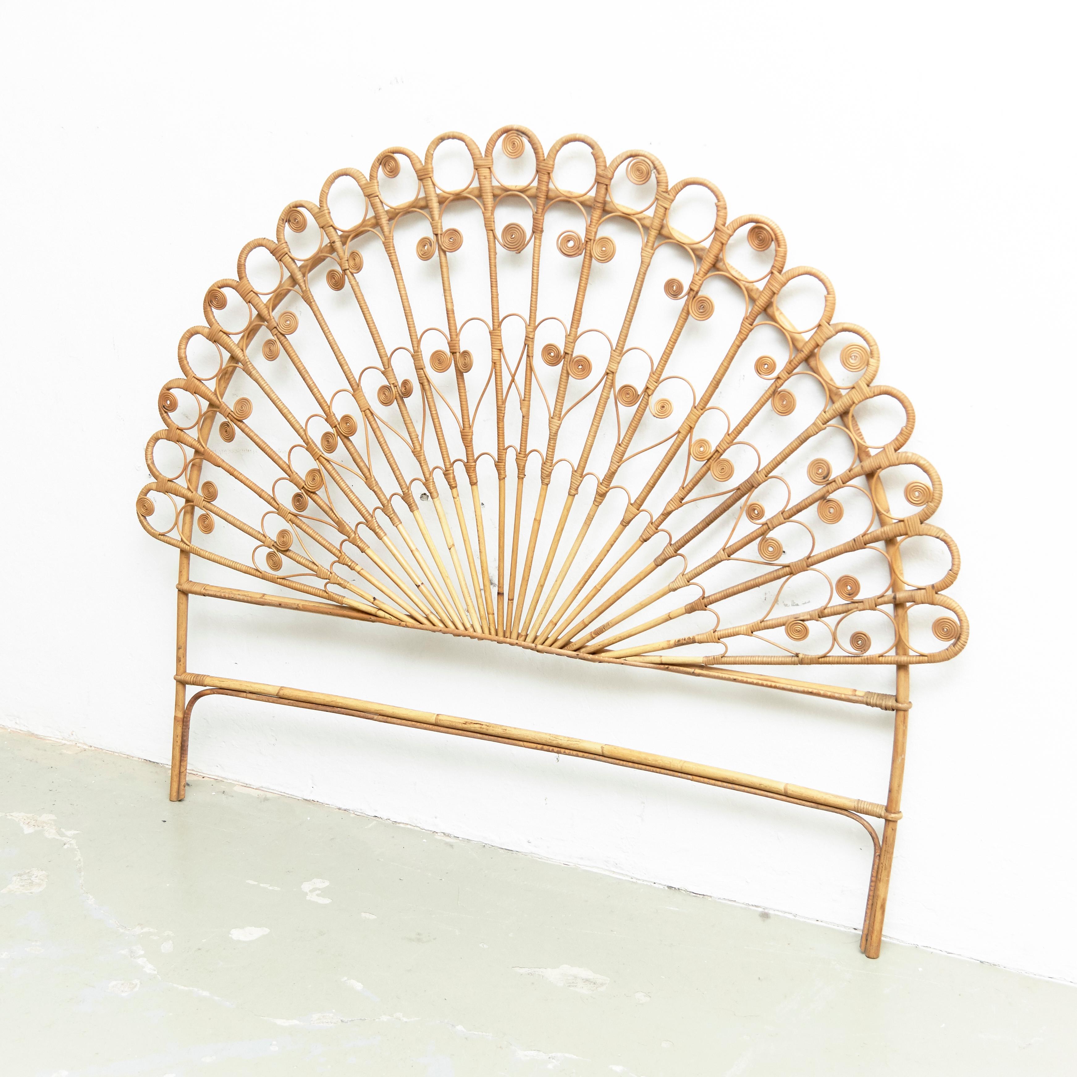 Mid-Century Modern bamboo and rattan headboard, circa 1960
Traditionally manufactured in France.
By unknown designer.

In original condition with minor wear consistent of age and use, preserving a beautiful patina.

