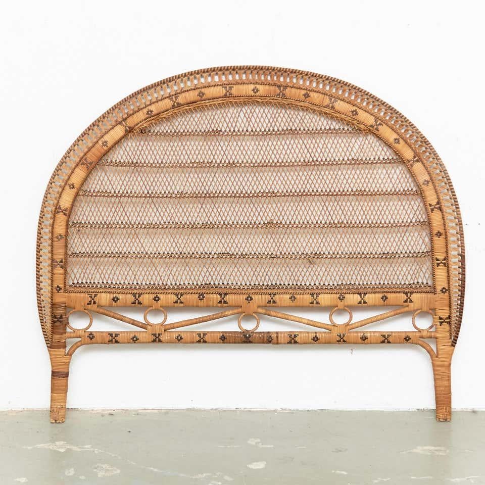 Mid-Century Modern bamboo and rattan headboard, circa 1960
Traditionally manufactured in France.
By unknown designer.

In original condition with minor wear consistent of age and use, preserving a beautiful patina.

