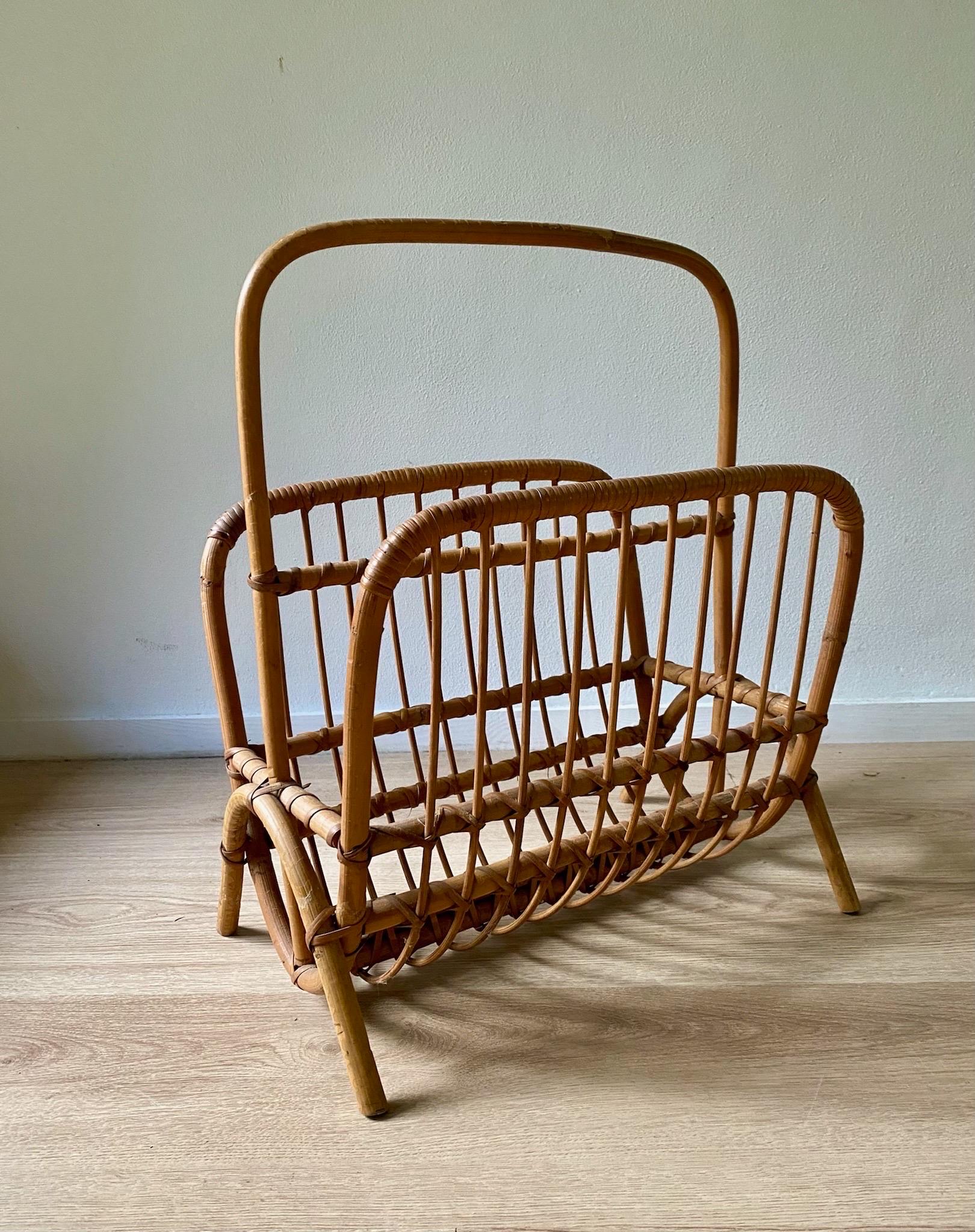 Mid-Century Modern Bamboo and Rattan Magazine Holder with handle ca. 1960's
By unknown designer and manufacturer, but similar with work of Rohé Noordwolde. Style similar to Franco Albini.

In original condition with minor wear, consistent of age