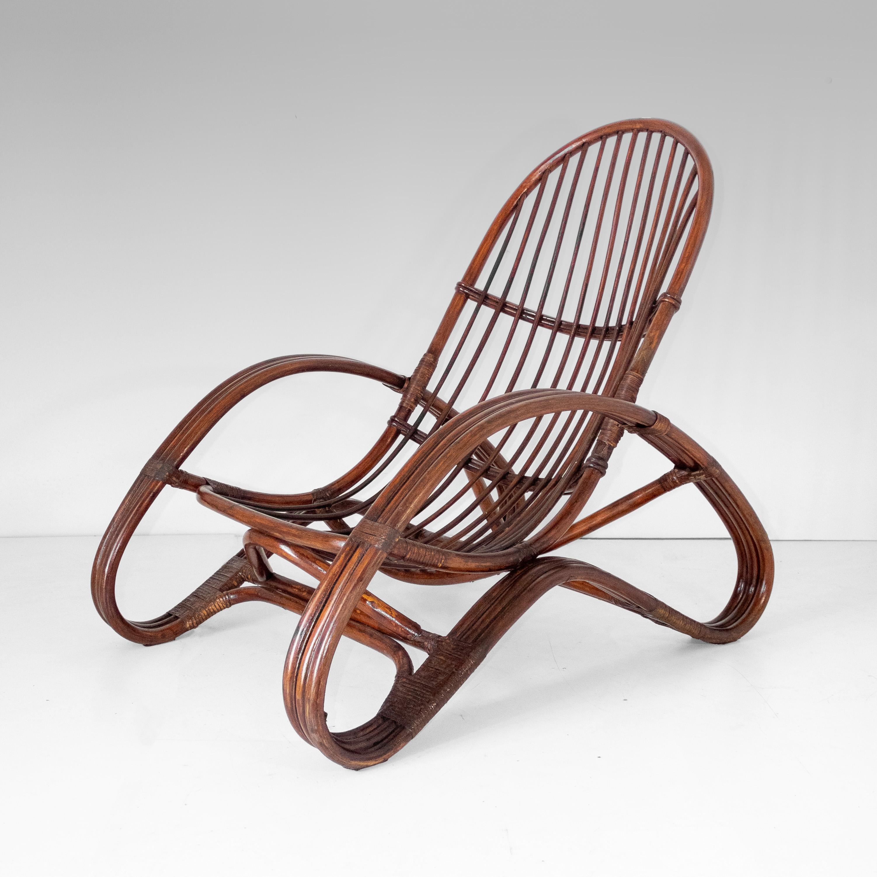 Mid Century Modern Bamboo Armchair in the style of Tito Agnoli, Italy 1960s

Stylish Bamboo Armchair, crafted in Italy during the 1960s. This piece embodies the era's appreciation for natural materials and elegant design, presenting a beautiful