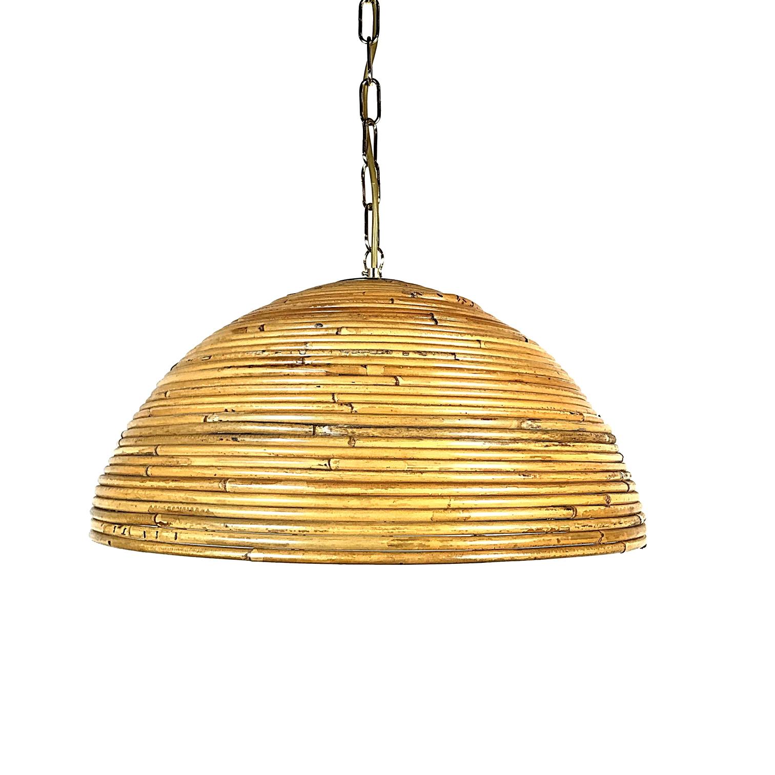 Beautiful midcentury pendant lamp handcrafted in Italy. This lamp is a striking appearance in any room, this lamp is a perfect representation of the 1950s period because of their design, quality and functionality. The lamp is made of bamboo and